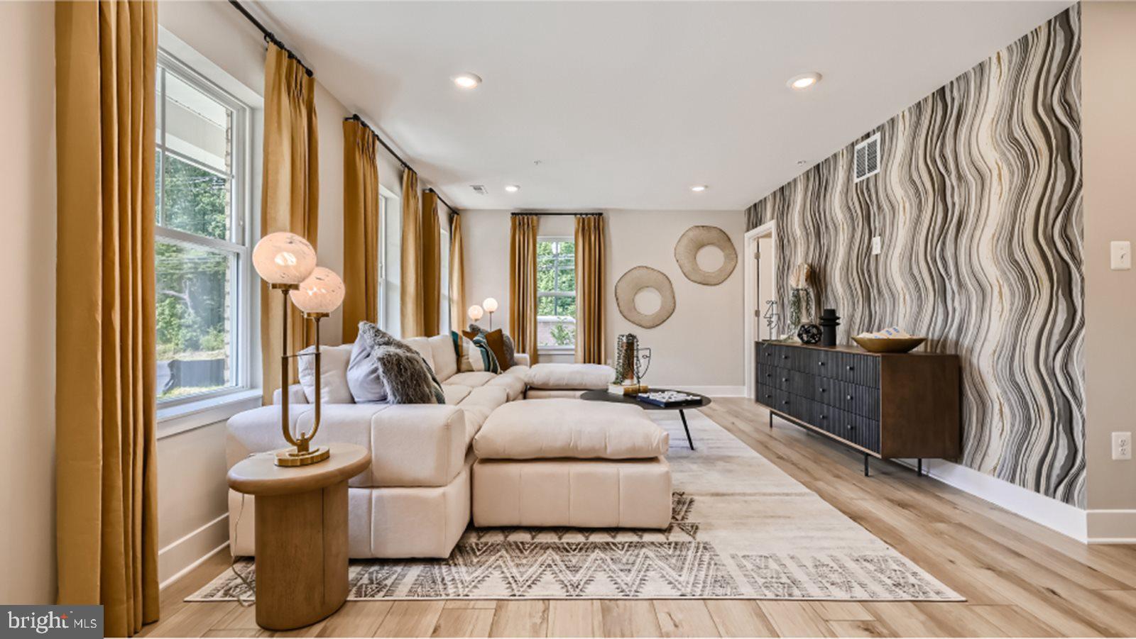 This amazing Ellicott townhome has 2,736 sq. ft. with 3 bedrooms, 2 full baths and 2 half baths. Situated on the first floor, two versatile flex spaces on main level can be used as a recreation room for family games, comfortable lounging, and home office. Enhancing the convenience and functionality of the first level is a half bathroom. You will have excess to the backyard for outdoor living space. On the second level the kitchen is equipped with an oversized center island that doubles a breakfast bar, sparkling granite countertops, stainless steel appliances, designer cabinetry and a roomy pantry. Ample countertop space that provides plenty of room for food prep and casual meals. The Dining room is fit for casual weekend brunches and upscale celebrations alike. The sun-drenched family room flows to the kitchen to make everyday living a breeze. The third level owner’s suite features a spa-inspired bathroom with a glass-enclosed shower with built-in seating, double vanities and a generous walk-in closet, plus an optional tray ceiling. The owner’s bathroom has dual sinks, and a generous glass-enclosed shower make mornings simple. A separate commode area adds an extra layer of privacy to the en-suite bathroom. Built-in shelving optimizes this spacious walk-in closet for organizing wardrobes, shoe collections, accessories and linens. Two secondary bedrooms are situated down the hall from the owner’s suite. There’s a full bathroom shared between the secondary bedrooms. The laundry room is conveniently located among the bedrooms on the second floor, which helps simplify household tasks.
The photos provided are for illustration purposes only, and not of actual home.
Homeowners will enjoy an onsite community center, swimming pool, exercise room, dog parks, tot lots, and walking trails. St. Charles Highlands is near great shops, restaurants, parks, and golf courses for outdoor activities. The Capital Beltway offers easy access to Washington, D.C.