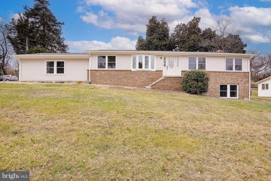 Hillside Place is simple coastal class , meets Calvert County country. This thoughtfully, renovated rambler is truly the best of both worlds when it comes to design. On the main floor you will find gorgeous tiles, beachwood colored & water resistant laminate flooring, gold fixtures, stylish lighting, and lots of natural light from the expansive bay window. On this floor you will have seasonal views of the Chesapeake Bay. You will feel as though you are truly on top of the world while looking out from the almost top of the hill, corner lot property. The kitchen features a 9 foot galley style built-in buffet with a mermaid tile backsplash and gorgeous quartz countertops. It is generously accompanied by a large breakfast area that leads to the backyard. At the front of the house, you will find a formal dining room and a large living room. Down the hall there are two bedrooms and a full bath, along with the primary suite featuring an en suite bathroom. The shower extends that beachy vibe with sea glass tile inserts, and sandy white tiles covering the walls of the shower. 

Hillside Place also features a fully finished basement. You can access the basement from the kitchen or from outside through the side entrance. The basement has a warm and cozy feel with lush, new, neutral colored carpet, rustic, light, fixtures, two large bonus rooms and a recreational room already wired with in- wall set up for TV hook up. In the basement, you will also find a full bathroom complete with custom barn door entry. The laundry and utility room is also in the basement. 

Although some landscaping has been done, including a new retaining wall, gravel parking pad,seed. & straw,  front walkway with pebbles and stepping stones, and lots, and lots of brush, shrub, tree and trailer removal, there is still plenty of room for you to create the backyard of your dreams. You’ve got a clean slate to work with, and the possibilities are endless. 

I would be remiss if I did not mention that the roof, soffit, gutters, siding, windows and doors, with the exception of one door have all been replaced brand new! The drain fields, 14 feet deep with above and beyond gravel and pipe, have been Majorly overdone and are only three years old. This home also has. an oversized 2 car, sideload  attached garage.

Enjoy all the neighborhood of Breezy point has to offer all year round. Most recently they decorated the meadow for the holidays. Throughout the year, they host various community events, as well as the year-round access to the private neighborhood beach, as well as the public beach, the marina and playground.