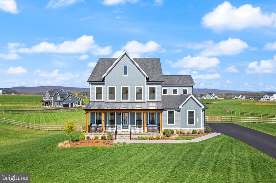 Welcome to a rare opportunity on one of Glenmore Farm's most premium lots!  This 2023 built Belmont II model by Van Metre offers the absolute best of both worlds - the feeling of brand new construction while also having completed all of the post-build to-dos and upgrades!  This lot was one of the first ones purchased in the neighborhood, which is no surprise because it boasts STUNNING mountain views from almost every room and offers a pristine and flat 3 acre outdoor space.  The Belmont II is one of Van Metre's most well-designed floor plans - the main level is highlighted by an open layout, oversized gourmet eat-in kitchen with a massive center island and butler's pantry, spacious main living room, 10 foot ceilings, Trex deck overlooking the beautiful yard, and so much natural light!  If that wasn't enough, you'll also enjoy a large walk-in pantry, office/bonus room space, and a mudroom area that welcomes you as you enter from the side-load 2 car garage!  Additionally, there is a lovely formal dining room and formal sitting room towards the front of the home.  Upstairs you'll find 4 spacious bedrooms and 3 full bathrooms, including an expansive primary suite with a bump out, two walk-in closets, and spa-like primary bathroom complete with double vanities, soaking tub, and large shower with two shower heads!  Each remaining bedroom has full bathroom direct access - two bedrooms are connected by a Jack and Jill bathroom, while the fourth has its own en-suite bathroom.  The upper level also boasts a fantastic laundry room with a sink and plenty of room for future cabinetry and design.  A bonus is an oversized walk-in linen closet - so useful!  Downstairs you'll find a basement offering so many options - you've got plenty of room for an entertainment setup, recreation space, and built-in plumbing for a future wet bar!  There's also  the fifth bedroom and a full bathroom that's perfect for a guest space, and the walk-in closet offers plenty of storage!  You'll also find a full size unfinished room with an egress window - use it as a gym, storage room, or convert it to a sixth bedroom with a pre-plumbed ensuite bathroom.  Now let's head outside and see what Western Loudoun living is all about - views and privacy!  Whether you're standing on the beautiful Trex deck, relaxing down below on the concrete patio, or simply looking out of a window, you'll feel what makes Glenmore Farm so special.  Spectacular mountain views, plenty of space between the homes, and a beautiful backyard - all boxes are checked!  In terms of upgrades, over $60,000 has been invested into this home with a whole house generator with surge protection, Trex deck and concrete patio, full 3 board fence, window treatments, induction stove top, propane supply line hookup for a gas grill outside, exterior hot tub outlet, 2 EV chargers, light fixtures, a tankless water heater, and full water treatment system.  This luxury home truly has so much to offer, so be sure to come see it for yourself!