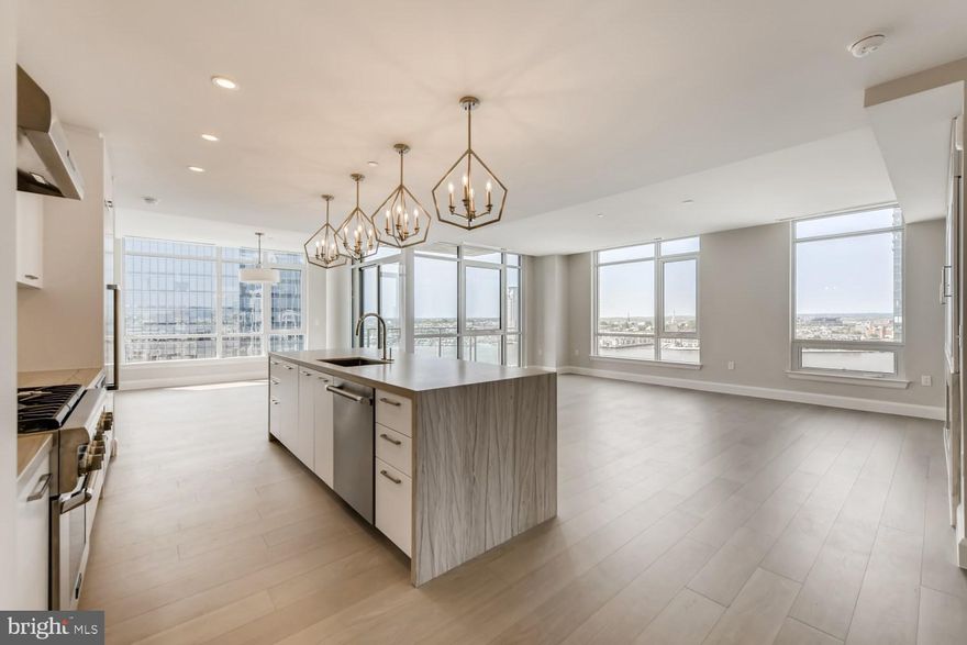 This impeccably designed light filled corner 2 bedroom 2.5 bath residence for lease features  2,000 square feet,  10-ft ceilings, wide plank oak hardwood flooring throughout, floor to ceiling windows with stunning city views. The state-of-the-art open kitchen is a chefs dream, masterfully designed and meticulously appointed with Italkraft custom cabinetry and premium appliances by Thermador including a gas range with vented wall hood, and MicroDrawer microwave. The stunning waterfall island of Calcatta marble flows seamlessly into the entertaining space with gas fireplace. The master bedroom suite offers a walk-in closet. The spa-like master bathroom is truly a work of art, outfitted with Kallista & Kohler fixtures, Carrara marble floors and walls, expansive shower and custom designed marble dual vanity.  Liberty Harbor East is Baltimores newest luxury waterfront address. The boutique condominium offering 33 residences with stunning waterfront architecture, designer finishes, and an enviable Harbor East location atop a brand new flagship Whole Foods Market create the opportunity for the ultimate downtown lifestyle. Liberty is located in the heart of Harbor East surrounded by best-in-class dining, shopping and conveniences of downtown living. Residents will enjoy a private Concierge level with social lounge, automated and secured package room and ButterflyMX intercom security system. Residents will also enjoy access to over 30,000 square feet of private, state-of-the-art indoor and outdoor amenity spaces including a clubroom with indoor/outdoor bar, rooftop infinity pool deck with cabanas, courtyard seating, grilling stations, communal and private dining rooms with catering kitchen, fitness center, yoga studio, Pet park with dog agility and training equipment, conference rooms, study lounge with computer stations and fireplace.