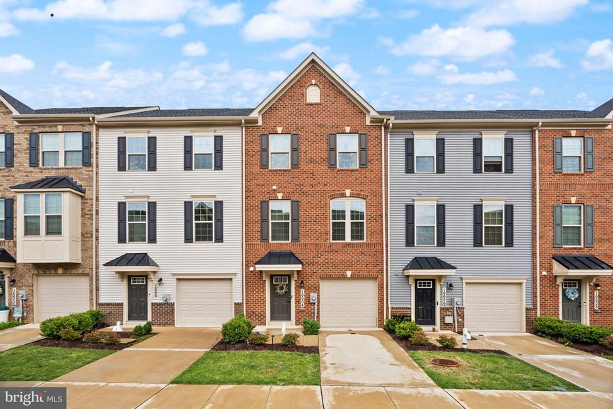 From the moment you walk in, this home just feels right. Light-filled, thoughtfully designed, and truly move-in ready, it’s the kind of place that’s easy to picture yourself in from day one.
This beautifully maintained 3-bedroom, 2 full and 2 half bath townhome delivers an effortless flow across the main level, where soaring ceilings and an open-concept layout bring the living, dining, and kitchen spaces together in all the right ways. The chef-inspired kitchen anchors the space with a generous island, perfect for morning coffee or evening entertaining, paired with sleek modern finishes, stainless steel appliances, and a pantry that keeps everything within reach. Step outside to the back deck, your private extension of the living space, ideal for summer gatherings, quiet evenings, or anything in between.

Upstairs, the primary suite is a true retreat. A tray ceiling adds architectural elegance, while a spacious walk-in closet and a spa-like bath with dual vanities and an oversized walk-in shower make unwinding effortless. Two additional bedrooms, a full hall bath, and a brand-new washer and dryer round out the upper level with everyday comfort that truly makes a difference.

The lower level opens up even more possibilities, offering a finished recreation space ready to become your home office, gym, media room, or all three, plus an additional half bath for added flexibility.

An attached garage adds convenience. Built by Ryan Homes, the home reflects quality craftsmanship and modern design. The community offers a strong lineup of amenities, including a pool, basketball and pickleball courts, and more.

Commuting is simple with quick access to Route 210 and the Capital Beltway, all while coming home to a setting that feels a world away from the hustle.