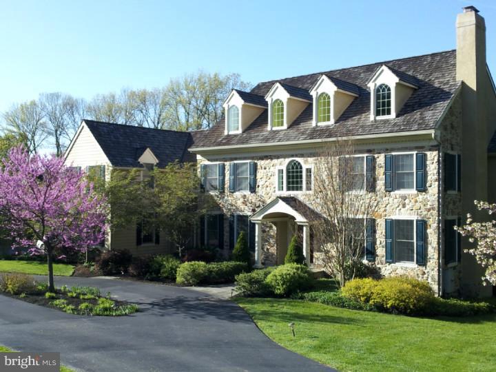 This 5 bedroom, 6 bathroom, 4 car garage home is located in the desirable Harrison Estates, only minutes from EA, Notre Dame, and nearby golf clubs. Move in ready this family friendly home has everything you need and is the best priced home in the community. The raised patio, spa, waterfall, and pool overlook the open space along Church Rd. A welcoming two-story foyer with grand staircase is flanked by a formal living room with a wood fireplace and spacious dining room. A connecting butler's pantry with wine refrigerator leads to a custom kitchen replete with premium appliances, including a Viking gas range with griddle, two ovens, built in Sub-Zero refrigerator, and Bosch dishwasher. The large granite island and adjacent breakfast room offers ample space for gathering with family and friends, serving meals, and entertaining guests. The first floor is completed by a large family room with fireplace, two powder rooms, office, sunroom, and a mudroom, which leads to the four-car garage, and a back staircase. Both the sunroom and breakfast room are outfitted with sliding glass doors that open onto an expansive stone patio with a hot tub/spa that can be enjoyed year round. Just down the curving, slate stairway, visitors will find a heated pool and striking waterfall. Both are encircled by gardens that overlook the remainder of the backyard, which is large enough for fun, pets, games, and outdoor activities. Upstairs, space abounds between the home's five bedrooms, four bathrooms, and a spacious sitting/TV area. The master bedroom suite includes his and hers walk-in closets adjoining a separate dressing room and sitting area. The elegant master bathroom features custom cabinetry, a Whirlpool tub, and his and hers vanity spaces. Just down the hallway are four additional bedrooms, two of which feature adjoining full bathrooms, while two others are connected by a jack and jill bathroom. The home's second floor is complemented by a centrally located laundry room and sitting area which leads to a bright, carpeted third floor that provides additional storage space, or makes for a perfect space to "hang out". Two heating systems controlling 4 zones with Aprilaire humidifiers and electronic air cleaners will keep your family and this beautiful home comfortable year round. We invite you to visit 4 Harrison Drive, a house that will easily become a home for you and yours.