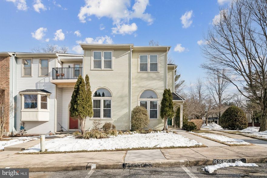 Welcome to this impressive transitional townhome in the heart of Columbia, where light-filled living spaces and thoughtful design create an inviting place to call home. Meticulously cared-for and enhanced with a brand NEW ROOF (2026), this residence offers a spacious foyer, a convenient powder room, and a comfortable main living area highlighted by soaring 12+ foot ceilings and arch transom windows that fill the home with natural light. The 2nd level hosts the kitchen with stainless steel appliances, garden window, and sliding doors to the deck. A 4th bedroom or study / office is tucked away on this level. The large dining room overlooks the living room. The upper level is highlighted by a light-filled staircase accented with large windows, leading to a spacious owner’s suite with a skylight, and a beautifully updated en-suite bath featuring double vanities and a walk-in closet. Two additional generously sized bedrooms share a full bathroom. The lower level offers a welcoming family room, complete with a wet bar, and a full-size window and sliding doors that open to the patio, while the lowest level provides abundant storage and a private, separate laundry room. The owner has updated systems to include the gas furnace and hot water heater. This neighborhood offers convenience to schools, restaurants, shopping, commuter routes and Blandair Regional Park.