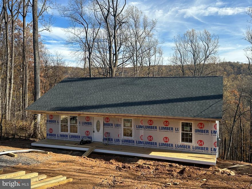 30 DAY CLOSING POSSIBLE! House almost complete! Great VIEWS! Amazing builder makes new construction fun-listing agent has sold more than 15 with this builder to thrilled buyers. This is NOW UNDER CONSTRUCTION (most photos similar, some of actual progress)–this home is extremely upgraded w/ shaker cabinets, granite counters, luxury vinyl plank flooring in entire main level! BONUS 24x12 deck is included! Nestled on.84 acres in a dream location (near a wildlife management area with hiking, mountain biking, Appalachian trail access, 1.5 miles from lovely winery–high speed internet is available).  This spacious home offers an open vaulted kitchen/dining/great room, stainless appliances (side by side fridge w/ water & ice in door, smooth top range), primary bedroom with oversized private bathroom, roomy guest bedrooms (12x10), ceiling fans in great room and all bedrooms, satin nickel hardware throughout, double sinks in both bathrooms, oak railing to basement, full covered front porch, full 9 foot high unfinished basement w/ windows and rough in plumbing (walkout w/ pad outside door), architectural shingles, low-E energy efficient double hung windows (with window sills), four motion detector flood lights, front and rear hose spigots, painted exterior foundation to match siding,  and more! SEE DOCUMENTS SECTION on the MLS listing for SO MUCH info about the area and the home (including floorplan)  Enjoy the many recreation areas of SHENANDOAH FARMS:  Farms Riverview Boat Landing ● Farms River Road Rec Lot ● Lake of the Clouds ● Spring Lake ● Shenandoah River Lane Rec Lot ● Treasure Island ● John “Junior” Shipe Park ● Venus Branch Bus Stop Park ● Shenandoah Farms Community Center   Call agent for glowing references from the happy 15+ buyers and agents we just closed with--the builder is FANTASTIC! Happy to set up a ZOOM call to "meet" him! See photos for carpet/flooring color samples--some choices remain for buyers who act quickly! Most photos similar!