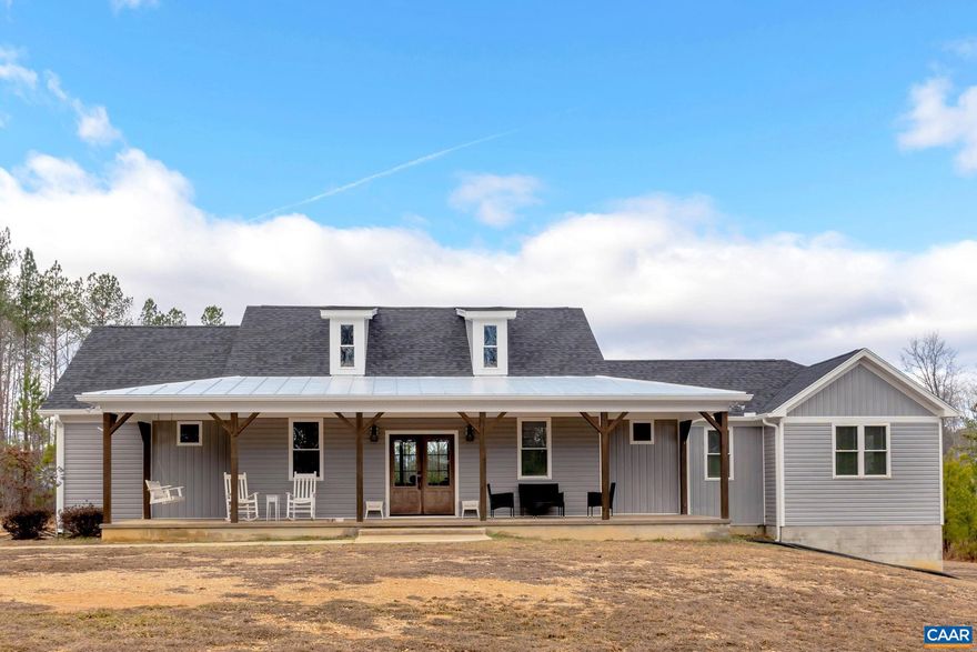 Come home to this beautiful custom designed showplace situtated on 10 private acres! This rustic farmhouse style is simply gorgeous!  High ceilings, large windows, and spaciousness have been blended to create a one story masterpiece.  Lots of nice touches make this one a must see!,Fireplace in Living Room