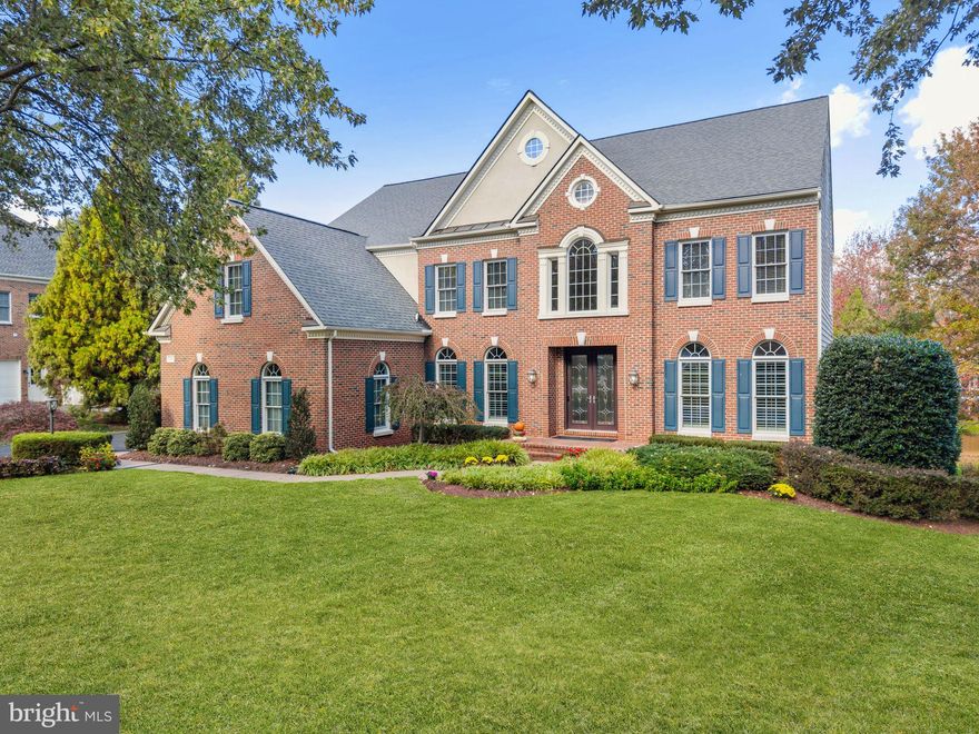 Located in Fairfax’s prestigious Oak Hill Estates, this exceptional 5BR/4.5BA home offers refined luxury in a prime location—just minutes to shopping, dining, I-66, Route 50, Fairfax County Parkway, Vienna Metro, & Fair Oaks Hospital. Sited on a beautifully manicured .95-acre lot, the exterior impresses with professional landscaping, underground sprinkler system, exterior lighting upgrades (’20), & a newly stained (’25) IPE deck with covered pavilion. Outdoor living continues with a brick patio with integrated lighting, a separate firepit patio with peaceful glimpses of water views, & two tranquil water features—a cascading 3-tiered fountain & natural rock water feature. An inviting front walkway leads to an oversized brick stoop & stately brick front, anchored by an elegant double-door leaded-glass entry, while the newly paved driveway (’23) leads to the 3-car garage. Inside, the home offers a turnkey, sun-filled floor plan blending luxury with everyday comfort. The soaring 2-Story Foyer features gleaming hardwoods, custom crown moulding, wall sconces, and a designer chandelier with Aladdin lift, with hardwoods extending throughout most of the main level. Formal Living and Dining Rooms flank the Foyer and showcase elegant mouldings, plantation shutters, and designer lighting, while the quartz-topped (’20) Butler’s Pantry connects the Dining Room to the Chef’s Gourmet Kitchen. The 2-story Family Room features gleaming hardwoods, a dual-sided gas fireplace, and a rear hardwood staircase with carpet runner leading to the upper level, & flows seamlessly into the Solarium, Kitchen, and Foyer. The Private Study includes french door entry, custom built-ins with quartz (’20), and ceiling speakers. The sunlit Solarium provides a serene retreat with walls of windows, tray ceiling, ceiling speakers, travertine tile flooring, shared fireplace, & sliding glass door to the deck. The Chef’s Gourmet Kitchen features gleaming quartz surfaces (’20), an expansive center island with barstool overhang & pendant lighting, hardwood flooring, stainless appliances (WOLF 6-burner cooktop/dbl oven with convection/mico w/convection oven & SUB-ZERO built-in refrigerator), 42" cabinetry with under-cabinet lighting, trendy tile backsplash (’20), dual pantries, ceiling speakers, & a sun-drenched Breakfast Room. An upgraded Half Bath with quartz solid wood vanity & a well-designed Mud Room complete the main level. Ascend to the upper level hallway with gleaming hardwoods & custom crown moulding. Double doors open to the Primary Suite featuring hardwoods, tray ceiling with fan, built-in speakers, a sunlit Sitting Area, & a custom wet bar with granite, mini refrigerator, wine refrigerator, & built-in coffee maker, along with double walk-in closets with custom systems. The spa-like updated Primary Bath (’23) features heated tile flooring, double quartz vanities, separate shower with dual shower heads, standalone tub, water closet, & direct access to an expansive walk-in closet with built-ins. Bedroom 2 includes an updated Ensuite Bath & closet system, while Bedrooms 3 & 4 share a well-appointed Full Bath with double granite vanities & tub/shower with tile surround. A Laundry Room completes the upper level. The sun-filled walk-out lower level offers a spacious Recreation Room with an entertainer’s bar featuring granite, wine/beverage coolers, separate ice maker, dishwasher, microwave, upgraded cabinetry, & ample seating. This level also includes a Den/Flex Room, 5th Bedroom (currently an Exercise Room), Full Bath with granite vanity &  separate shower, a Media Room with built-in speakers, & a large Utility/Storage Room with  workbench. UPDATES: Driveway (’23), Primary Bath (’23), Study built-ins (’20), Kitchen & Butler’s Pantry quartz & backsplash (’20), exterior lights (’20), water heater (’17), roof (’13), and multi-zone HVAC: UL (’11), ML (’17), Solarium & 5th Bedroom (’20), landscape uplighting & much more!
