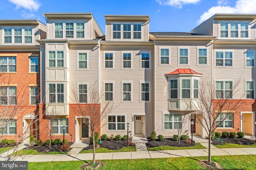 Four level turn-key townhome in Oxford Square presents over 2,160 finished sqft, an entry level stepping to a foyer and family room with stairs to the core level featuring a living room with a double windows adding to the natural light, LVP flooring that flows seamlessly into the central kitchen, and a dining room stepping out to the Trex® deck. Best recipes are made in this central kitchen boasting 42” Shaker cabinetry, sleek granite counters, a chef’s island with an elevated breakfast bar accented by pendant lighting, a pantry, stainless steel appliances, and a full size washer and dryer. The loft offers a relaxing area and access to the rooftop deck followed by the owner’s suite. GREAT Community amenities: pool, sports courts, shops, and a location close to commuter routes and the MARC station