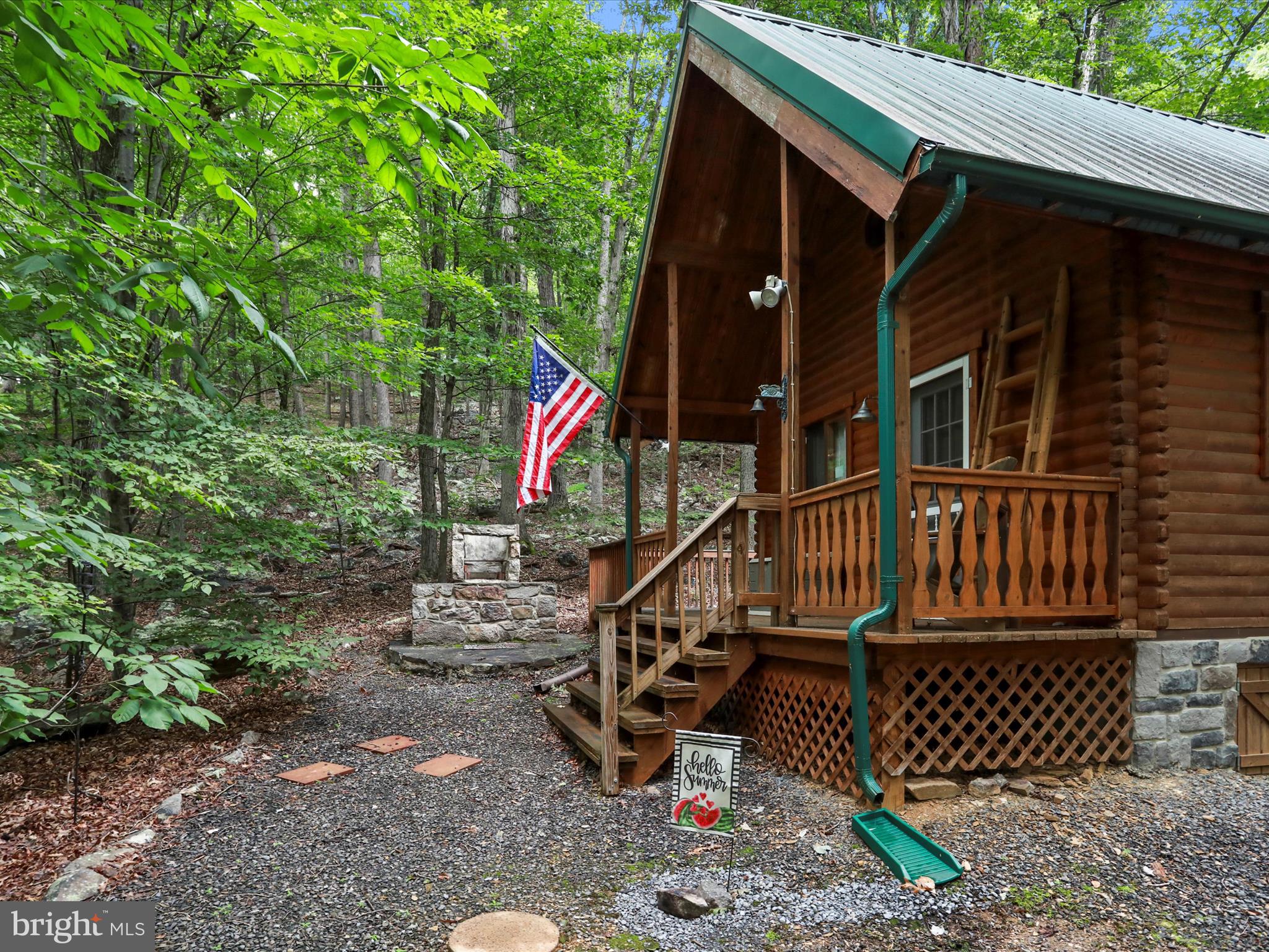 Tucked away in the serene woods of Rouse Mountain, this cozy log-sided cabin offers the ultimate escape to nature with all the comforts of home. Whether you’re looking for a full-time residence, a weekend retreat, or a short-term rental investment, this property is ready to impress.
Inside, you’ll find a large open living room with vaulted ceilings and a wood-burning stove, spacious bedrooms, and many upgrades. Step outside and enjoy peaceful views on the private gazebo and multiple other outdoor gathering areas — perfect for evening fires, morning coffee, or entertaining guests.
Highlights include:
• Elevated wooded lot for privacy and seclusion
• Large gravel driveway with easy access
• Covered front porch, back deck and gazebo for relaxing outdoors
• Two storage sheds for all your gear
• Deeded access to the Cacapon River just down the lane
Enjoy kayaking, fishing, hiking, and all the outdoor adventures the area is known for, while still being a short drive from downtown Berkeley Springs.
Don’t miss your chance to own a slice of mountain paradise!