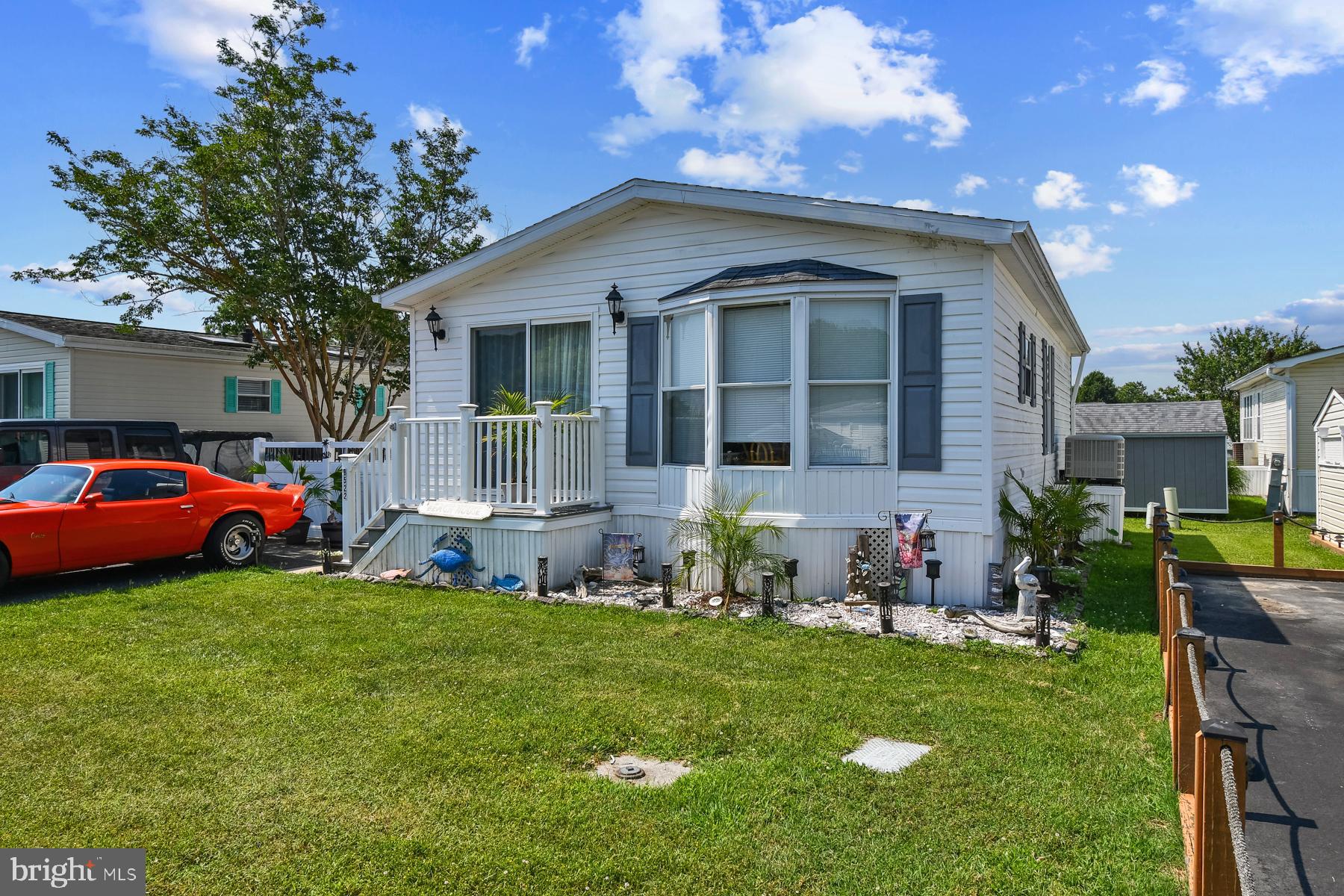 Welcome to your perfect beach escape located in the Assateague Point community! This well-maintained 2-bedroom, 1-bathroom home offers the ideal blend of comfort, convenience, and coastal charm. Step inside to find a bright, open living space with plenty of natural light, an efficient layout, and a fully equipped kitchen. Both bedrooms offer cozy retreats, while the full bathroom is clean and functional. Enjoy your morning coffee or evening sunsets on the patio - perfect for outdoor dining or relaxing after a day at the beach. Updated, low maintenance flooring and fresh paint make this place ready to move right into! Located in a gated, waterfront community, you'll enjoy access to two swimming pools, a clubhouse, crabbing pier, kayak launch, playgrounds, and a host of family-friendly amenities. Convenient location makes it a breeze to get to the Ocean City and Assateague beaches, dining, shopping, and so much more. Come see everything this great home has to offer - schedule your private showing today!