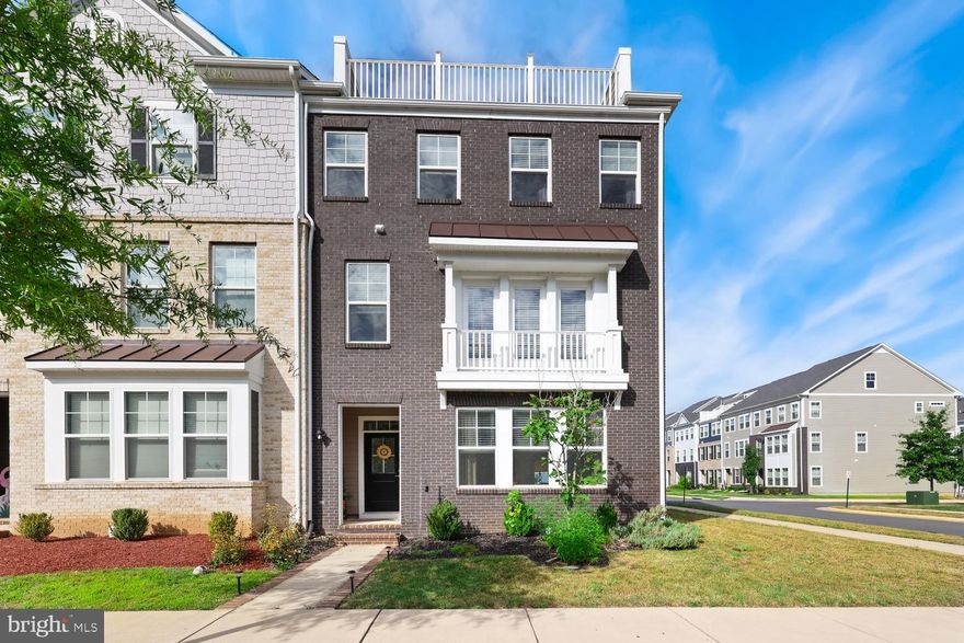 Welcome to this stunning 4-level townhome built in 2020—modern, spacious, and sparkling from top to bottom!

Step inside and you'll immediately notice the beautiful luxury vinyl plank flooring that flows throughout the main level. To your right, the light-filled family room creates a warm and inviting space to relax or entertain. A convenient half bath is tucked just off the family room, followed by a versatile bonus room—perfect for a home office, study, or personal gym.

Continue through to the rear-loading 2-car attached garage, offering both ease and functionality.

Upstairs, the second level impresses with an open-concept design. The heart of the home is the gourmet kitchen, complete with a massive island that's ideal for entertaining. There's a cozy dining area to the left with access to your private balcony—perfect for morning coffee or evening sunsets. Beyond the kitchen, the spacious living room offers endless layout possibilities, and a second half bath adds even more convenience.

On the third level, the luxurious primary suite awaits with a huge walk-in closet and a spa-inspired en suite bathroom featuring a large walk-in shower, double vanity, and sleek white tile. Down the hall, you’ll find the laundry area, a second full bathroom with double vanity and tub/shower, and two additional bright and airy bedrooms.

And don’t miss the fourth level—a true highlight of the home! Use this flexible space as a recreation room, office, media space, or game room. A third half bath is located here, along with access to your private rooftop terrace offering gorgeous views of the community.

This is more than a home—it's a lifestyle. Come see it today! * * * Mortgage savings may be available for buyers of this listing * * *