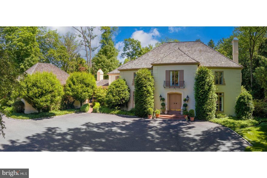 Embrace tranquility without compromising on accessibility and convenience. 71 Tunbridge Road is nestled on a beautiful sprawling 2+ acre lot in the esteemed Merion Golf neighborhood.  It offers a rare opportunity to live in a tightly knit community where homes are seldom available. Crafted by the acclaimed architect Perc Kennedy, this timeless, 6210 Square Foot, French Manor home, was constructed in 1975, includes 6 Bedrooms, 4 Full Baths, and 2 Half Baths.
Approaching the home by a long gracious curved driveway to the courtyard confirms you have arrived someplace special and offers lots of parking on the property. Enter through the double Chateau-style front doors to find a marble-tiled Foyer adorned with a sweeping staircase - a prelude to the elegance found within.  Bathed in natural light streaming through expansive windows and featuring an open floor plan with soaring ceilings, this home exudes an inviting ambiance. The main level includes a spacious Living Room with a gas fireplace and is complemented by French doors overlooking the lush gardens. Adjacent to the living area, is a grand formal Dining Room with French doors also overlooking the tranquil lush gardens and spacious patio. A wood paneled Library/Den offers a quiet retreat for relaxation, while the grand Family Room adorned with wooden built-ins and a floor to ceiling brick gas fireplace, is the perfect space to unwind and enjoy time with family and friends. Adjacent to the Family Room is the sun-drenched Breakfast Room, ideal for enjoying morning coffee, flows seamlessly into the Gourmet Kitchen, with a large central island, and high-end appliances. Completing this level is a convenient main floor bonus room, currently used as a guest Bedroom with an en-suite Bath, would be a perfect work-from-home office.  There's a Mudroom with a back entrance, a spacious Laundry Room, and an oversized attached 3-Car Garage, offering ample storage and functionality.

The upper level offers the luxurious Primary Bedroom Suite, featuring a spacious dressing room and an en-suite Bathroom for ultimate comfort and convenience. Three additional Bedrooms, along with two Full Bathrooms, await with their own unique blend of comfort and style. The finished third floor is ideal as a 5th Bedroom offering lots of privacy.  The finished Basement offers additional space to tailor to your lifestyle needs. Experience comfort and convenience with an automatic generator ensuring uninterrupted power for the entire house during outages.

The meticulously landscaped grounds surrounding the property offer a verdant oasis of tranquility. You'll be captivated by views from the brick patio area, offering two covered dining spaces where you can indulge in al-fresco dining under the stars. The mature lush landscaping provides a picturesque backdrop for your outdoor gatherings. Multiple lounge areas beckon you to unwind and relax in style, each thoughtfully positioned to offer the utmost privacy and comfort. Whether you're lounging with a book in hand or entertaining guests, the outdoor spaces provide the perfect setting for both relaxation and recreation.
Beyond the confines of this exquisite home, discover a wealth of amenities just moments away. Stroll to the renowned Merion Golf Club, host to numerous prestigious championships, or explore the eclectic array of shops and eateries lining Montgomery Avenue and Suburban Square. Nature enthusiasts will appreciate the nearby Haverford Reserve and College Nature Trail, while commuters will enjoy easy access to Center City Philadelphia via the nearby Haverford and Ardmore stations.
Located in the acclaimed Haverford School District and in proximity to esteemed institutions, including The Haverford School and Friends School Haverford, the home offers unparalleled lifestyle on the prestigious Main Line.  Experience the perfect blend of serenity, sophistication, and convenience at 
71 Tunbridge Rd.  It epitomizes the classic Main Line estate.