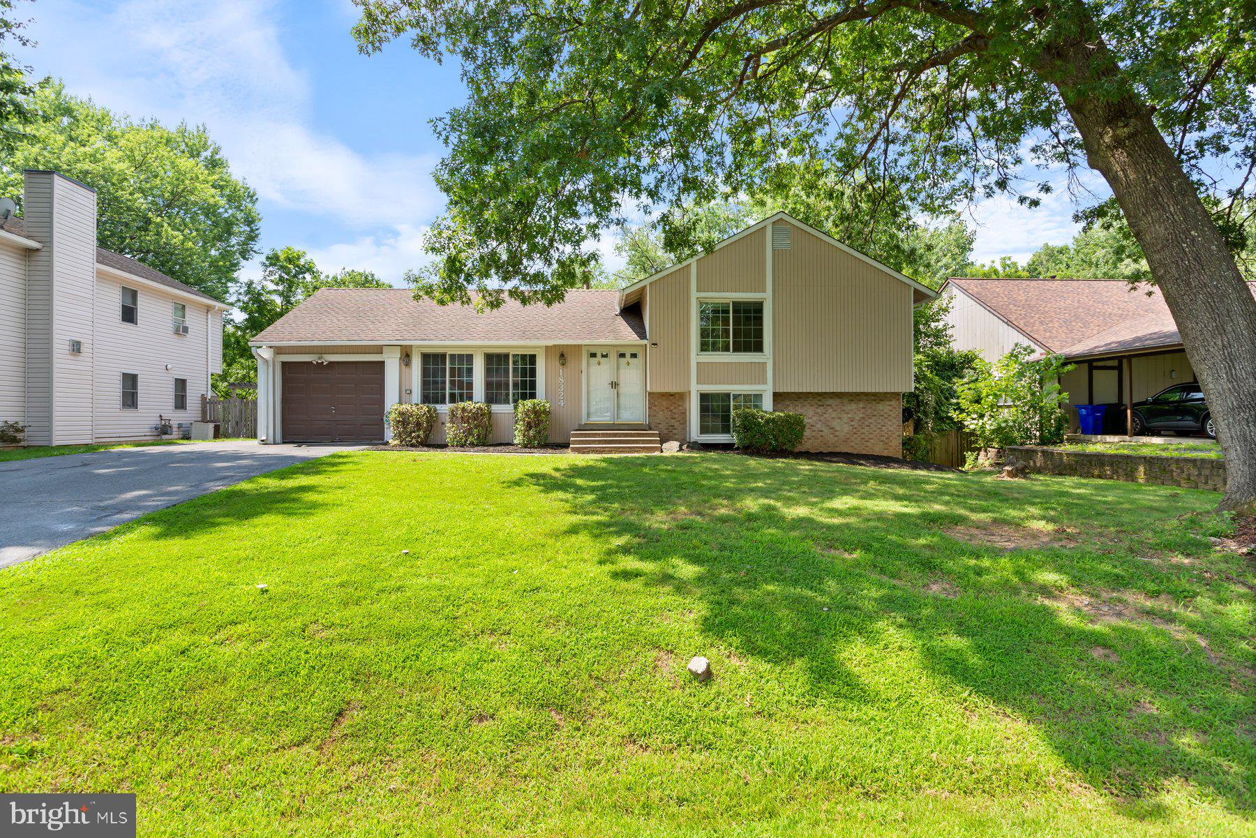 Nestled in the highly desirable community of Olney, Maryland, this exceptional four-level split home offers the perfect combination of spacious living, privacy, and unbeatable convenience. With 4 bedrooms and 3 full baths, this residence is everything you've been searching for and more! Enjoy peace of mind with major updates already taken care of, including a newer roof, water heater, and windows. The exterior has been freshly painted, and the deck has been beautifully refurbished and stained, ensuring move-in readiness. Step inside and be greeted by gleaming hardwood floors in the main level living room and separate dining room – perfect for hosting formal gatherings. The spacious kitchen offers ample room for culinary creativity and flows seamlessly into a versatile two-room addition, providing endless possibilities for your lifestyle. Upstairs, unwind in your private primary suite, complete with its own full ensuite bath. Two additional generously sized bedrooms and a shared full hall bath (new flooring) offer comfortable accommodations for family or guests. The cozy, fully finished family room on the lower level is the ideal spot for relaxing evenings, centered around a welcoming fireplace. This level also features a fourth bedroom and full bath, providing incredible flexibility for guests, an au pair, or a home office. Need even more space? The sub-basement offers fantastic bonus room, perfect for a home gym, playroom, or media center! Outside, your private backyard sanctuary awaits! Entertain with ease on the large deck and stamped concrete patio, overlooking a serene, fenced yard that backs onto a park-like setting. Enjoy year-round tranquility with a shed and a charming clubhouse/playhouse, offering endless outdoor fun. Experience the best of suburban living with unbeatable proximity to Olney's abundant shopping, dining, entertainment, schools, and parks. This home truly offers exceptional value and the perfect blend of comfort and convenience. Don't miss the opportunity to make this incredible Olney home yours!