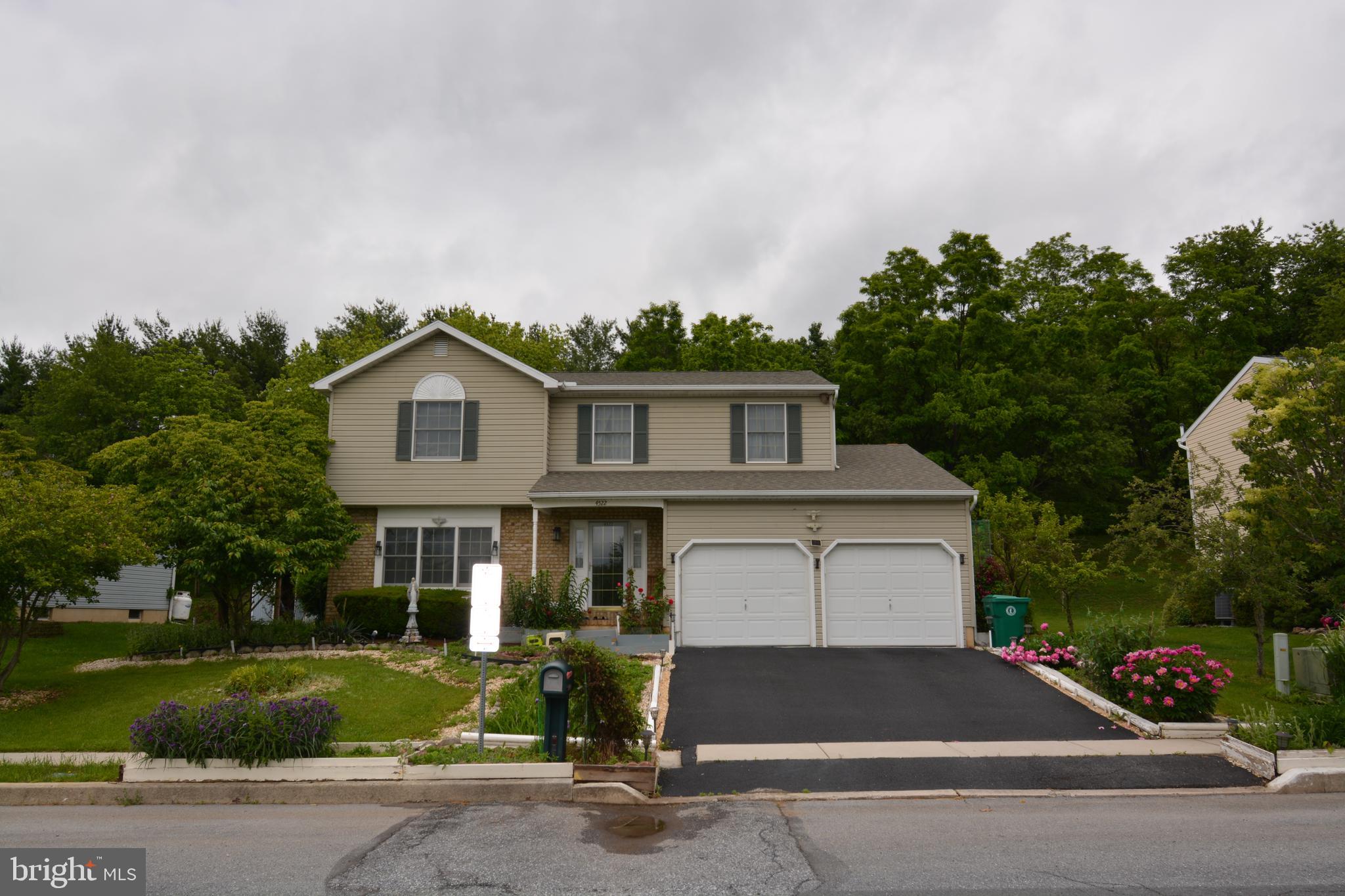Welcome to this spacious home in the desirable Carrollton Estates, located in the top-rated Central Dauphin School district. Major renovations costing over $70k completed in 2021 including a new roof. First floor has a formal living and dining room, a large kitchen with a breakfast area, main floor laundry, half bath and a sunken living room complete with a fireplace. From the living room, step outside and enjoy various fruit trees(apple, asian pears, grape vines and more!), a lovely fishpond and playset! Upstairs you will find 4 spacious bedrooms. Primary suite has a large walk-in closet and bath. Lower level is unfinished but has walkout stairs waiting for the home's new owner to make it their own.