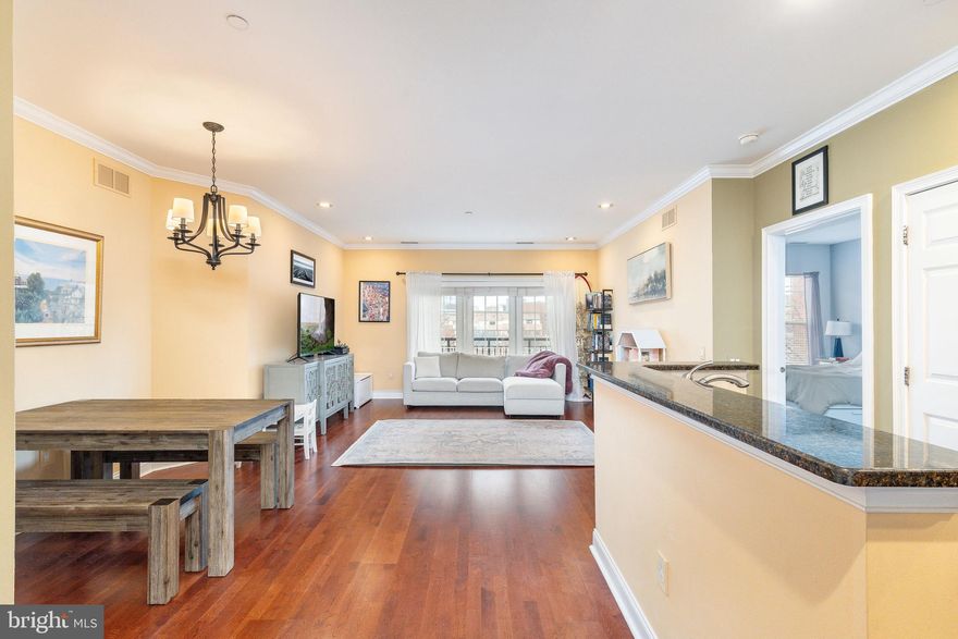 Rarely offered in Naval Square, this west-facing two-bedroom, two-bath “Wellington” residence includes one deeded, secure PARKING space and is located in the Strickland Building within this beautiful gated Graduate Hospital community. The home’s highly desirable split-suite floor plan places each bedroom and bathroom on opposite sides of the main living area, offering excellent privacy and flexibility.

The chef-inspired kitchen features upgraded cherry cabinetry, a pantry, stainless steel GE appliances, a marble tile backsplash, granite countertops, and an inviting breakfast bar ideal for dining or entertaining. The open-concept living and dining space is enhanced ​by crown molding, ​recessed lighting, Brazilian cherry hardwood floors, and a glass sliding door that opens to a Juliet balcony with skyline views.

The spacious primary suite offers a large walk-in closet and a luxurious en-suite bath with a double vanity, soaking tub, separate glass-enclosed shower, and linen storage. The second bedroom is equally well-appointed with its own generous walk-in closet and convenient access to a full hall bath with a tub/shower combination. A side-by-side laundry area and dedicated storage locker further enhance the home’s functionality.

Naval Square is a premier, gated community set on beautifully landscaped grounds, offering residents a state-of-the-art fitness center, outdoor pool with sundeck, concierge services, and 24-hour security. Ideally situated near Fitler Square and Graduate Hospital, with easy access to Penn, CHOP, HUP, Rittenhouse Square, Schuylkill River Park, and all that Center City living has to offer.

All of this​, plus secure, gated parking just steps from your door. A truly exceptional opportunity not to be missed.

Condo is tenant occupied through June 2026