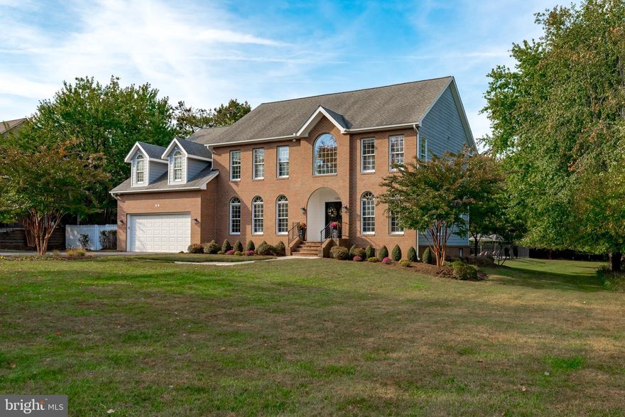 Stately brick colonial in sought-after Fishing Creek Farm. Set on a large lot with in-ground pool among elegant custom homes. Professionally updated with thoughtful renovations and quality materials. Open floor plan with unique features allowing for seamless indoor/outdoor living. Main level includes character-grade white oak floors, true gourmet kitchen with Wolf range, SubZero 36" fridge and 36" freezer, built-in dining banquet, two sinks, quartz counter tops, pantry plus quality cabinetry. Mud room and laundry room off garage with powder room and additional storage nook. Family room with gas fireplace, vaulted ceilings, and built-ins plus private office and large dining room. Outdoor entertaining area features AZEK decking serviced by full bath and detached wet bar. Four bedrooms on the second floor with 3 full baths... primary bathroom has his and hers. Lower level features media room, gym, and fifth bedroom and bathroom. The amenity-rich community of Fishing Creek Farm includes tennis courts, marina, waterside pool, and a clubhouse. Easy commute to Washington, Baltimore, the Eastern Shore, and more.