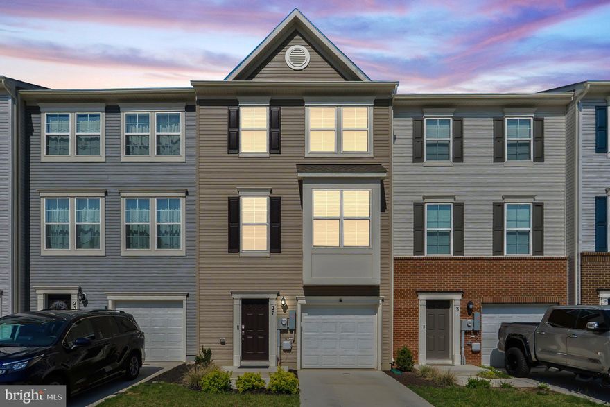 Built in 2023 - This nearly new 3-bedroom, 2 full bath, 2 half bath townhome gives you 1,922 square feet of space that actually works for how people live today — and it’s in a highly desirable location close to everything: community amenities, shopping, dining, and major commuter routes for an easy drive to wherever you need to be. The entry level offers a wide, welcoming foyer with durable LVP flooring and a flexible bonus room that’s perfect as a playroom, home gym, office, or second hangout space. Step out back to the open yard ready for pets, a grill, or both. Head upstairs to an open main level with clean lines, great light, and LVP floors that flow through the entire space. You’ll find a huge living area that opens into a kitchen with an island the size of an actual island (totally kidding, but its massive!)  perfect for cooking, eating, working, or gathering with friends. Granite counters, stainless steel appliances, and a legit dining area make this level the heart of the home. And yes, there's a deck off the back for morning coffee or evening takeout or if you're like me, grill and chill. Upstairs, the primary bedroom has a walk-in closet and a private bath with a double sink vanity and a tiled shower with a built-in bench. Two more bedrooms are upstairs, along with a full hall bath and a laundry room where it actually makes sense to do laundry (because it’s on the same level as your clothes). And here's the kicker — we're offering a bonus in the form of some closing cost help for the buyer! Same layout and square footage as others nearby, but this one gives you more — more updates, more usable space, and more value. You don’t want to miss this one!