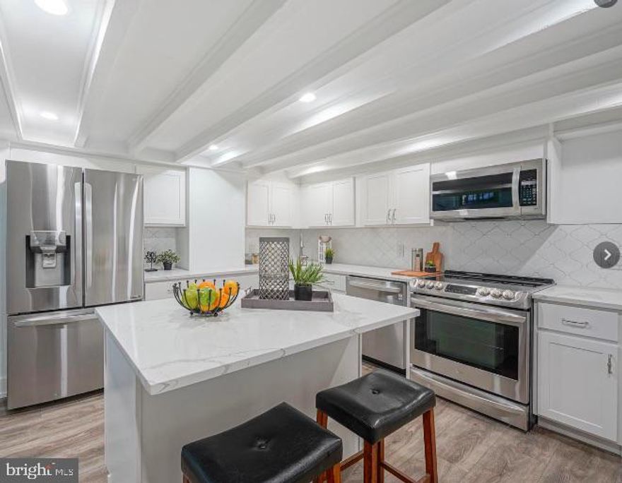 Welcome to this super chic 2 bedroom, 2 bath, updated row home in Society Hill. This home is spread over 2 stories and offers beautiful high-end finishes. The main level includes a living room with stunning hardwood floors, a full brand new bathroom and a bedroom. When you head down the spiral wooden staircase, you will find the beautiful eat in kitchen, a second bedroom, another full bath and your washer/dryer. And don't forget to enjoy a cup of coffee on the shared back patio. You're right in the center of everything:  Old City, Penn's Landing, boutiques, restaurants, cafes, bars,  farmers markets, convenience stores, South Street and so much more. Rent includes, water, sewer and trash removal. This rental can come furnished (as shown in pictures) for an additional monthly fee. It's a perfect solution for anyone relocating for work or school, offering a hassle-free, move-in ready space with all the essentials included.