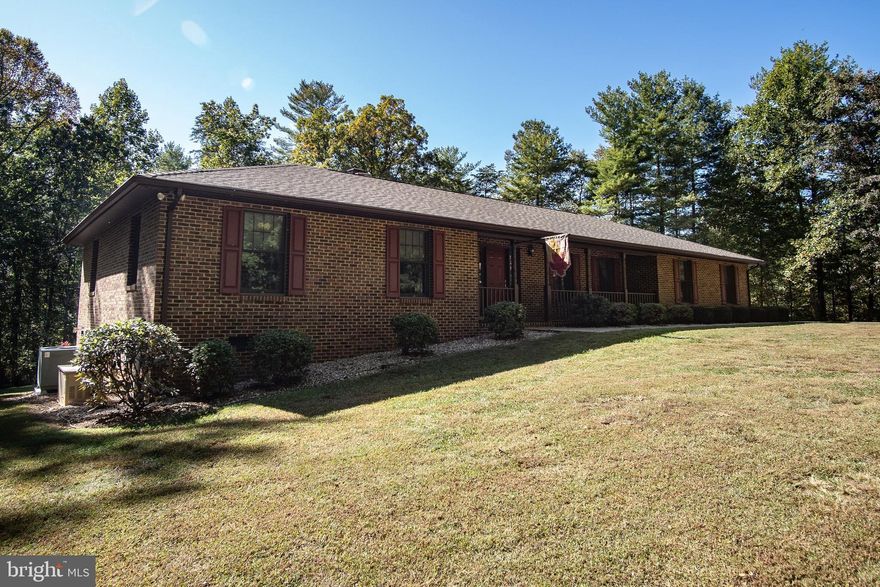 You must read the upgrades document, this BRICK ranch house has a DUEL furnace system and WHOLE house generator that are fueled by a 500 GAL propane tank. The 30-year Shingle roof is only 4 years old. The 16' x 20' OCTAGON deck is newly renovated and stained. This five acre property has several garden spots, a 12' x 20'  SHED and a ROCK wall leading up the the PAVED driveway to the DOUBLE garage which has a new auto-opening system.  Double-pane ANDERSON windows are throughout the house and all wood trim is beautifully stained and coated with polyurethane.  All CEILINGS are professionally and tastefully hand styled with unique plaster designs. The STONE fireplace is gas but can convert to wood.