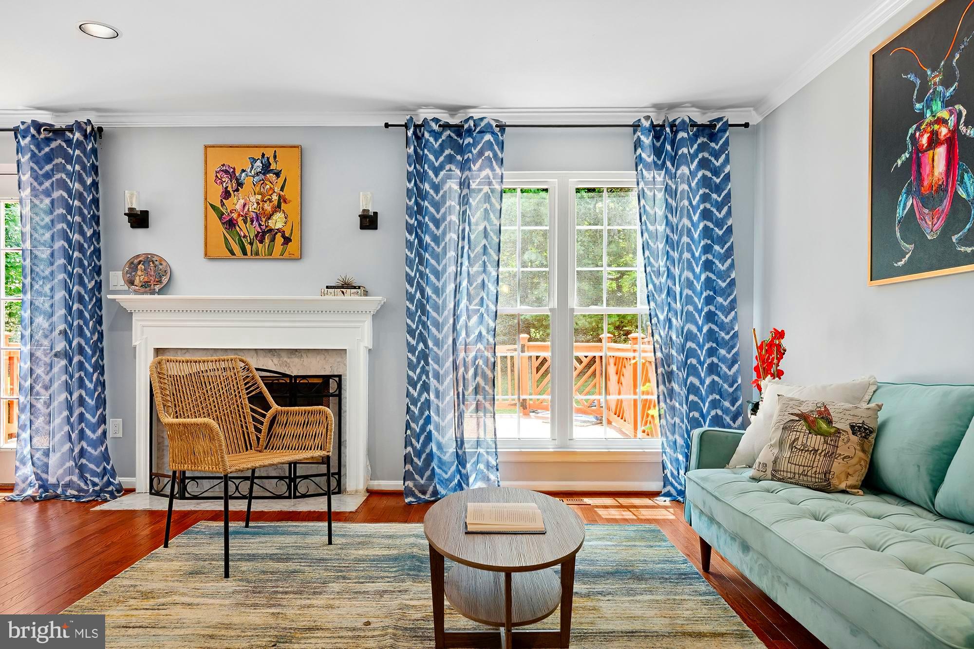 Step into style and space in this sun-filled end-of-group townhome in coveted Chapel Gate, offering 4+ bedrooms, 3.5 baths, and four finished levels designed for modern living. The welcoming foyer steps up to a central hallway that connects the updated kitchen—featuring granite counters, stainless steel appliances, and a sunny breakfast nook—with the open-concept living and dining area, complete with a sleek gas fireplace. Upstairs, the vaulted primary suite offers a spa-inspired bath, while two additional bedrooms, a full hall bath, and full-size laundry round out the second level. The bright top-floor loft is perfect as a home office, studio, or 5th bedroom. A fully finished lower level includes a spacious family room, private bedroom, and full bath—ideal for guests or flexible living. Step out onto the full-width deck backing to trees for serene outdoor living. With hardwood floors, crown molding, and major upgrades including a new roof (2021), new windows (2020), and high-end HVAC (2020), this home is move-in ready and perfectly located in the heart of Mays Chapel.