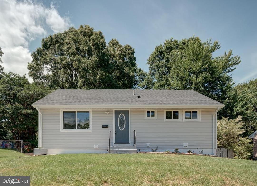 This beautiful turnkey home has been renovated! Big-ticket items have been upgraded like new floors, new roof shingles, new siding, new windows, new appliances, new washer/dryer, new granite countertops with new cabinets & backsplash, fresh paint in the interior and exterior, new light fixtures, and more. The AC and water heater are about 5 years old. The property has a large backyard that is almost fully fenced in and a driveway. There are 3 main level bedrooms with 1 full bath. All bathrooms have also been renovated. Basement includes 2 bedrooms and 2 full bath with a beautiful wet bar and plenty of living space. There is a back entrance for easy basement access.