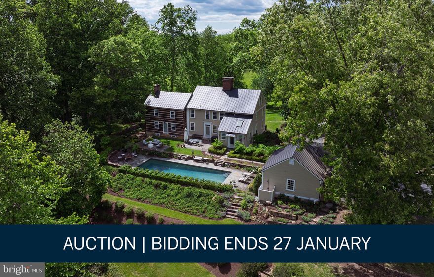 AUCTION BIDDING OPEN:  Bidding ends January 27. Previously listed at $4.25M. Current high bid $1.65M. Showings available daily by appointment.

A rare opportunity to own an extraordinary piece of Virginia history on this private 37-plus acre estate minutes from historic downtown Middleburg. The Nathan Ayer House, a distinguished Colonial built in 1790 in Connecticut and meticulously relocated to hunt country, showcases unparalleled craftsmanship with nine original stone fireplaces, hand-hewn exposed beams, and authentic period hardware throughout. Lush perennial gardens and an inviting heated pool create an idyllic retreat, while the late 19th-century bank barn—constructed from hand-hewn oak and poplar with fieldstone—offers limitless potential for equestrian pursuits, entertaining, or creative endeavors. Direct frontage along Goose Creek provides ultimate seclusion on this incomparable property where architectural heritage and countryside elegance converge in perfect harmony.