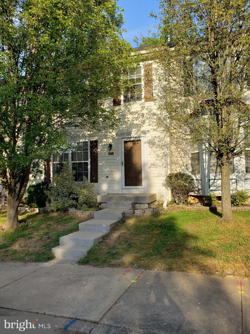 Welcome home to this beautiful 3 level Colonial style townhome in Winters Run Manor, featuring 3 bedrooms, 2 full baths, and 2 half baths and new carpet on the main and upper level! Beautifully landscaped with foundational bushes and a welcoming front porch, you'll instantly feel at home as you enter into the light and bright foyer that features a half bath, convenient foyer closet, and hardwood floors that extends into the kitchen. The spacious eat in kitchen features recessed lighting, plenty of cabinet and counter space, and a double sink with detachable faucet and a look through view into the living room. Also features all black appliances, including a double door fridge with ice maker. The open space layout features plush carpeting, crown molding pendant lighting, and a cozy wood burning fireplace with mantel. Enjoy streams of light coming from the sliding glass doors that open to the raised deck and lead to the completely fenced in backyard - the prefect place for a summertime BBQ! Take the stairs to the upper level to the main bedroom that features plush carpeting, recessed lighting, and an en-suite bathroom with soaking tub, glass shower, tile flooring, and built in floor to ceiling cabinets for extra storage space. Two bedrooms also with carpeting and recessed lighting complete the level, plus a hall bath. The walk out basement is perfect for additional living space or a rec-room and includes tile flooring, recessed lighting, and carpeting. Also features a half bath, and a combo storage/laundry room. Easy access to 95, shopping and dining. You do not want to miss this one!