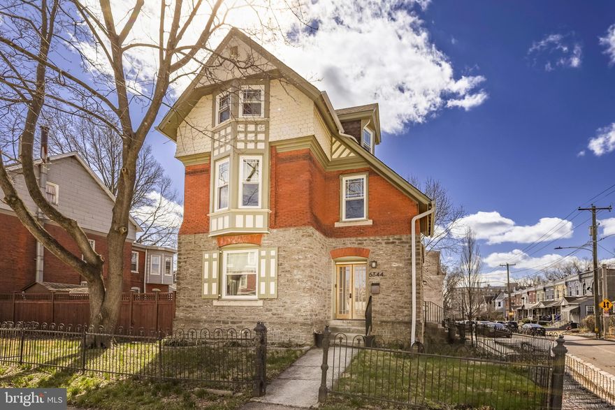 This architecturally significant 5-bedroom, 2.5-bath Victorian in West Germantown sits on a beautiful corner lot, perfectly blending 1870s character with modern luxury. The home welcomes you with a restored foyer highlighting an ornate turning staircase, original millwork, and random-width plank floors. The expansive light-filled living room, centered around a wood-burning fireplace, flows into a modern kitchen equipped with granite countertops, stainless steel appliances, ceramic tile flooring, a built-in spice rack, and a breakfast bar. A convenient first-floor powder room and laundry/mudroom add to the main level's functionality.

The second floor houses two bright and spacious bedrooms and a fully renovated main bath. The primary has a huge walk-in closet, and the secondary bedroom feels cozy and sweet like you're living in a fairytale. The upper level offers two additional sunny and well-balanced bedrooms. The finished lower level has a family room/theater with a full bath, plus a bonus space that makes a perfect gym or home office. The lower level also offers a dedicated workroom and storage area with a Bilco door for easy access.

The exterior is a private oasis, featuring a fully fenced rear and side garden, a covered back porch for entertaining, two patios, storage shed and a rare 2-car off-street gated parking pad. Located on one of the best blocks in Northwest Philly, you are within walking distance of the footpaths of the gorgeous Wissahickon Valley, Weavers Way Coop, cafes, schools, and two regional rail lines to help get you downtown quickly. Follow the creek and the river for an easy drive to Center City or head north to the vibrant shopping districts of Mt. Airy Village and Chestnut Hill. This home offers the perfect balance of historic charm, community, contemporary living, and convenience. Come, make 6344 McCallum yours!