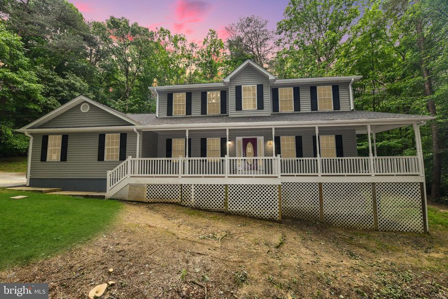 Beautifully renovated gorgeous house nestled in the woods with amazing nature views. This spacious and elegant house with 4 bedrooms, 3 full and a half bathrooms. Updated beautiful kitchen with quartz countertops, stylish tile backsplash, and stainless-steel appliances. The main level features a nice big living room with a fireplace, dining room, and updated kitchen with breakfast area. Recessed lighting, and modern light fixtures. Convenient upper-level spacious Laundry room. storage. Nice wood floors. New Paint. New Washer/Dryer. Huge deck and patio for outdoor lovers. Great location.