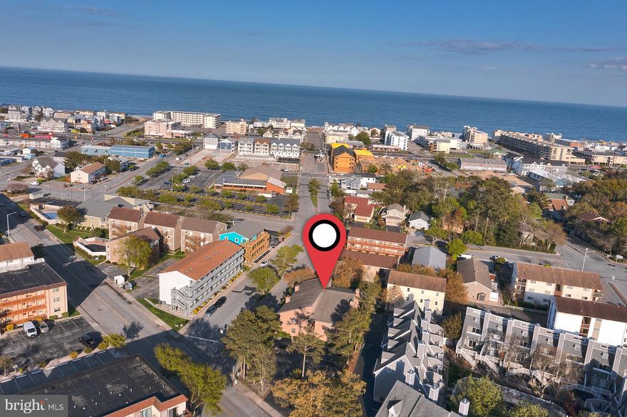 Excellent first-floor end unit #104 condominium Light House Square, conveniently located in North Ocean City, MD.  This well appointed residence provides two spacious bedrooms and two full bathrooms, features include open floor plan, stylish kitchen cabinets, and counter tops, plank flooring.  The living room features a cozy wood-burning fireplace.  Large deck runs along the exterior of the bedrooms and living space. Enjoy convenience of walking to the beach, bay, restaurants, shopping, and various attractions, all within close proximity. Fenwick Island is less than half a mile away. Don't miss this opportunity!