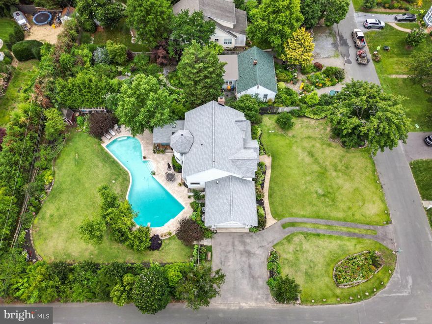 REDUCED BELOW APPRAISAL! Beautiful home in coveted Bay Ridge with over 2700 SF of comfortable living space, oversized 2 car garage and driveway with parking for 10+ cars and is located in the heart of this community with beautifully landscaped double corner lot,  hardwood flooring throughout main and upper levels and extra large custom heated pool.  Everything is centered around the fully fenced rear yard with pool (w/20 meter lap lane marked out in pool),  large patio and covered deck all surrounded by rich landscaped lawns and gardens.  The minute you enter the front screened porch you feel like you are on vacation!  There is a fun beach vibe throughout this home with cool Caribbean colors in every room starting with  the 2 story foyer with curved wall and dramatic staircase.  There is  a main floor Bedroom on the left and large formal Living and Dining Rooms on the right.  The main level also boasts a large Laundry Room,  full Bath, renovated eat in Kitchen with granite countertops, stainless appliances and the adjacent Family Room with large picture windows and both overlooking  the rear gardens and pool.  The upper level features 2 spacious Bedrooms, Hall Bath and spacious Primary Suite with walk-in closet and Super Bath with jetted tub and separate shower.  The lower level is unfinished but quite large and has stairway to the pool area. 

This home is located just a few blocks to the beautiful bay front community pool (bond required and yearly fee) , beaches, marina, club house,  playground and sports courts that includes a pickleball area.  Or you can take your golf cart, ride bikes or stroll along the Chesapeake Bay shoreline.  You will soon see why this is the most sought after neighborhood in Annapolis offering  annual festivities, parades and historical events, all organized by Bay Ridge residents.  There is nearby shopping & restaurants and easy access to all major commuting routes to DC, Baltimore and the Eastern Shore! Bay Ridge is a Special Tax Assessment District and the membership dues of $250 year are encouraged. Sellers have pool bond which will convey with the right offer!