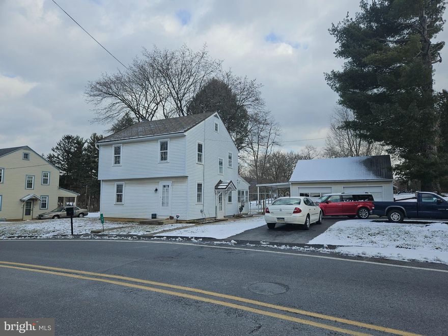 Charming Two Story Home with a big country lot!  Cozy kitchen, formal dining room, big living room and 3 bedrooms, all freshly painted.  Pretty wood floors.  Attractive slate look metal roof recently installed on house.  Enclosed rear porch plus covered porch off large detached 2 car garage.  The big rear yard has been fenced with sturdy American wire fencing. Looking for a place for a few chickens?  It appears this property fits the requirements of Greene Township's new chicken/duck ordinance.  (please very with the twp).  Additional interior photos coming soon!