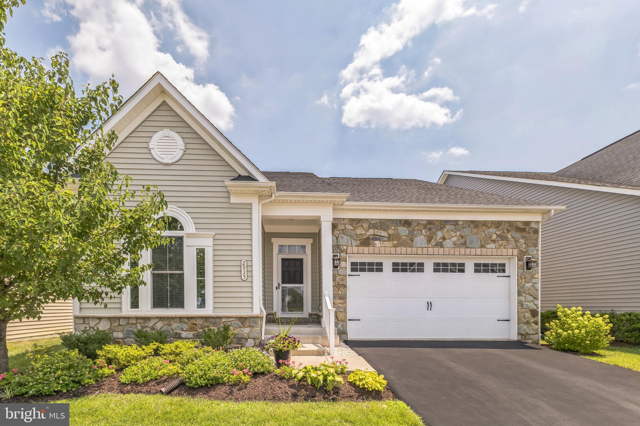Welcome to this beautifully maintained home in the sought-after age-qualified (55+) section of Two Rivers in Odenton—one of Anne Arundel County’s most desirable communities. Just a short walk from the vibrant community center, residents enjoy resort-style amenities including an outdoor pool, tennis and pickleball courts, grilling and dining areas designed for comfort and relaxation.
Step inside to an open-concept layout centered around a gourmet kitchen, perfect for entertaining. This chef-inspired space features a large island with seating for five, high-end stainless steel appliances including a gas cooktop, and a refrigerator and dishwasher replaced in 2021. The adjacent main-level laundry room is equipped with a newer washer and dryer (2021), adding to the home's convenience.
The primary suite is a true retreat, complete with a spacious bedroom, an oversized walk-in closet, and a luxury bath featuring a dual-sink vanity, large walk-in shower with new seamless glass door, updated finishes, and a private water closet.
Two additional bedrooms and another full bath are located on the main level, offering flexible space for guests, a home office, or hobbies. The fully finished basement provides a generous recreation area with a built-in sound system and walk-up access to the backyard—ideal for entertaining or relaxing. Additional highlights include a deck with powered retractable awning, a whole-house generator installed in 2023, a whole-house humidifier, and a freshly finished garage with textured epoxy flooring.
This home offers comfort, style, and peace of mind in a thriving, amenity-rich community.