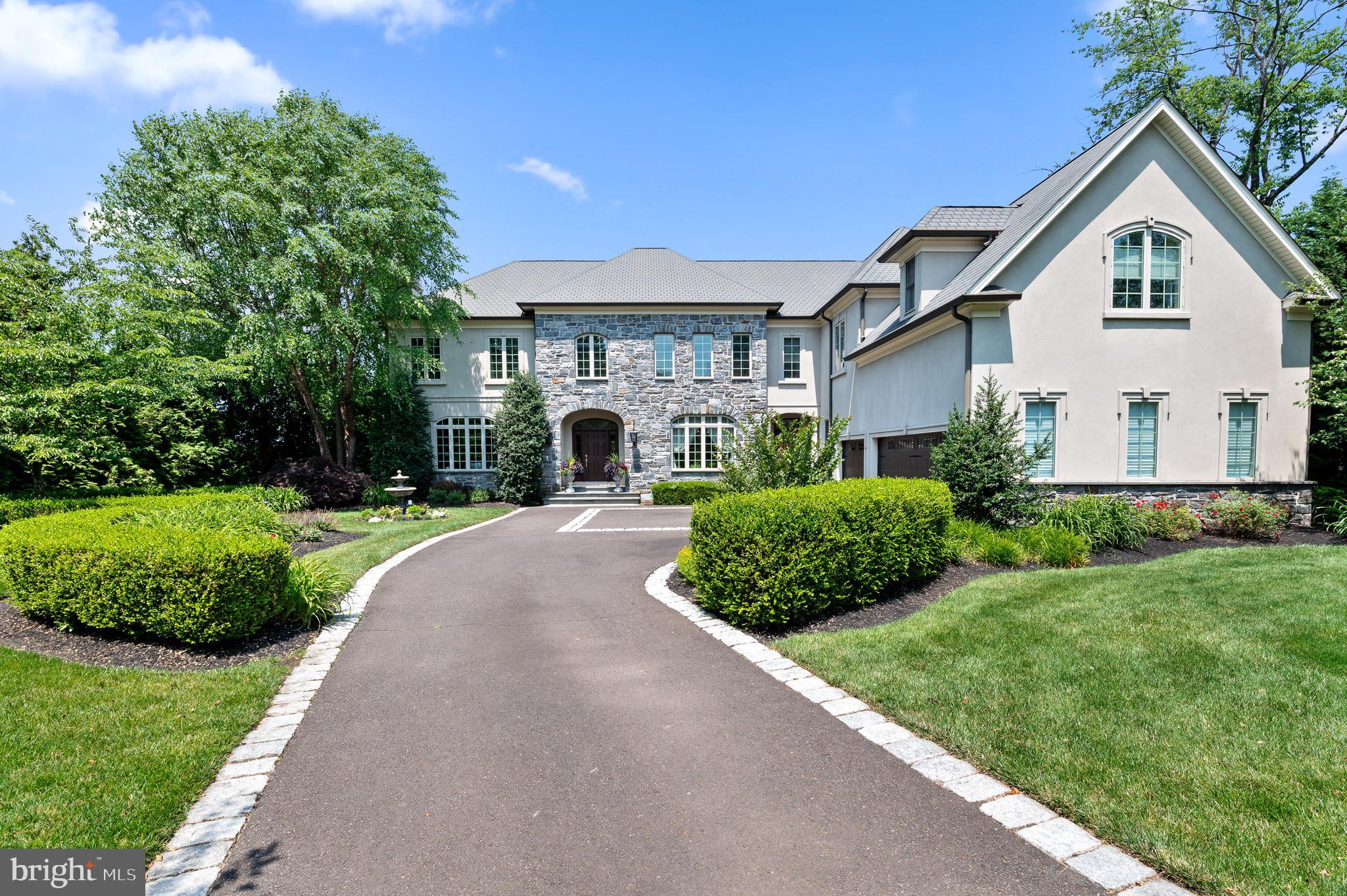 Professional pics coming soon!
Welcome home to this magnificent two-story estate home with 4 bedrooms, 4 full bathrooms and 2 half bathrooms located in the sought after Lower Moreland School District. An entertainers’ dream home boasting sweeping indoor and outdoor entertaining spaces while providing serene views for you and your guests. Once inside you will surely appreciate all the gracious, generously sized rooms and quality craftsmanship that make this home so special. Upon entry, you will be greeted by the oversized foyer with large custom tile and hardwood floors throughout the first floor. To the left is an elegant formal living room featuring a gas fireplace with marble inlay, gorgeous woodworking details, and large windows showcasing the natural sunlight.
To the right, is the dining room featuring a dual tray ceiling and chair rail. Open floor plan gourmet kitchen features large island with prep sink and expansive seating area. This space boasts Wolf range, sub zero refrigerator, granite countertops, warming drawer, Terazzo sink and pantry closet. The breakfast area leads to the outdoor 2 level patio, your own personal oasis. The current homeowner has been gifted with a green thumb and pride shows throughout the outdoor space. From the kitchen, there's a large two story great room with wood beam ceilings and custom wood fireplace. Mudroom, 2 powder rooms and office complete the first floor.
Primary suite has tray ceiling and is accompanied by a sitting area and customized massive walk-in closet and is complimented with a large master bath featuring a onyx stone floor with separate water closet and walk-in rain shower. Three additional generous size bedrooms with private bathrooms are complimented with a large hall featuring dual study areas.
You will be in awe of the custom tiered outdoor entertaining area features an upper 30x20 travertine stone patio, a custom stone saltwater pool with a travertine stone patio area and has a waterfall and large attached hot tub. This home also boasts a large unfinished walkout basement and 3 car attached garage. This home is a must see to appreciate everything it has to offer!