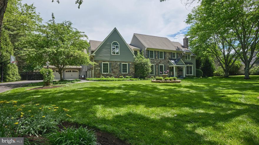 Welcome to the prestigious Buckingham neighborhood of Coldbrook, where winding tree-lined streets set the stage for this exceptional stone-front Colonial. Originally crafted by John Arrow Builders this wonderful home has been totally updated blending timeless elegance with modern comfort.  A bluestone walkway leads to the gracious covered portico. Inside, a dramatic two-story foyer with a turned wood staircase introduces the home’s classic architecture, refined millwork, hardwood flooring, and light-filled open layout. Formal living and dining rooms flank the foyer, flowing seamlessly into the home’s inviting gathering spaces. French doors open to a private first-floor study with custom built-ins.  At the heart of the home, the gourmet eat-in kitchen is designed to impress with custom cabinetry, quartz island and backsplash, custom gold brushed hardware and faucet, and premium stainless-steel appliances including a 6 burner Wolf professional range with double ovens, a Sub-Zero refrigerator, freezer and beverage cooler. The kitchen also features an adjacent organizational space that includes custom pantry built-ins. The adjacent breakfast area is adorned with custom built-ins and is overlooking the resort-style outdoor living areas and wooded backdrop. The cozy family room showcases a floor-to-ceiling stone fireplace with raised hearth and direct patio access.  A generously sized laundry room and half bath complete the first floor. Upstairs, the luxurious owner’s suite offers 2 professionally organized walk-in closets and spa-inspired bath complete with free standing soaking tub, seamless glass shower, radiant heated floors, double bowl custom vanities, and private water closet. Four additional generously sized bedrooms that includes a renovated “Jack and Jill”  bathroom and a generous sized hall bath.  The finished lower level expands the home’s entertainment possibilities with flex spaces ideal for gaming, fitness, or hobbies, and abundant storage. As an added bonus there is a detached 2 car garage with large private office. Outdoor living is equally spectacular, featuring a sparkling pool and spa surrounded by lush landscaping, expansive patio, fire pit and pool cabana. Beyond the property, a wooded trail connects directly to Maplewood Park and continues into historic Doylestown, where charming shops, acclaimed dining, and cultural attractions await. Ideally located with convenient access to New York, Princeton, and Philadelphia, and situated within the award-winning Central Bucks School District, this extraordinary property offers luxury living in one of Bucks County’s most coveted communities.