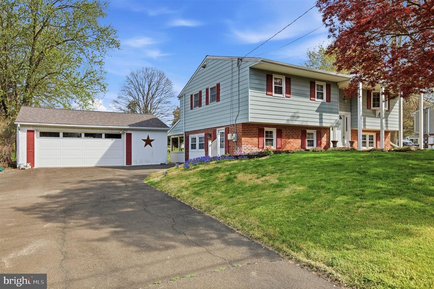 This charming split-level home has been thoughtfully updated and is ready for its next owner! Freshly painted with brand new flooring throughout, this home offers a bright and inviting feel from the moment you step inside. The entry foyer leads up to the main level, where you’ll find a spacious open living and dining area featuring beautiful new LVP flooring, perfect for everyday living and entertaining. The brand new kitchen offers off white cabinetry, stainless steel appliances, and upgraded countertop. This level also includes three well-sized bedrooms and a full hallway bathroom with a tub/shower combo. Downstairs, the home opens up to even more living space. A large family room with a cozy wood-burning fireplace and brick surround creates the perfect spot to relax. Toward the rear, an additional bright living area filled with natural light offers flexible use and provides direct access to the backyard. This lower level also features two additional bedrooms and a full bathroom, offering great flexibility and the potential to create a large primary suite. A convenient laundry room completes the interior of the home. Step outside to enjoy a screened-in area, a patio ideal for outdoor dining, and a fire pit setup. The expansive backyard includes plenty of space for play or gatherings. A large detached 2-car garage and an extended driveway with space for 3 additional vehicles provide ample parking and storage. Conveniently located in Chalfont, this home offers easy access to local parks, shopping, dining, and major roadways, making everyday living and commuting simple while still enjoying a quiet, residential setting. Schedule an appointment today!
