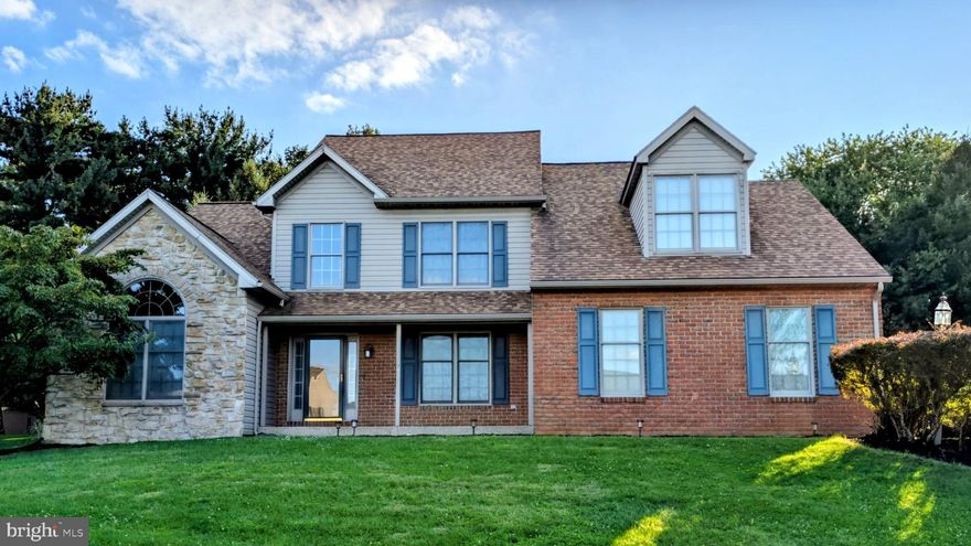 MANHEIM TWP.  Rare opportunity to own this exquisite 4 Bedroom, 2 ½ Bath home located in
prestigious Manheim Township School District. This spacious two-story home is nestled in a quiet cul-de-sac on almost a half-acre lot backed by mature trees. Highlights include first-floor Master Bedroom Suite with jetted tub and walk-in closet. Large Family Room with vaulted ceiling and gas fireplace. Oak kitchen with breakfast nook. Hardwood floors in entryway and in formal dining room adorned with crown molding. Expansive 4th bedroom above 3 car garage has a custom cedar walk-in closet. A beautiful backyard with cement patio is ready to host cookouts and outdoor entertainment. New updates in the last six years include Amana HVAC system with an Aprilaire whole house humidifier, CertainTeed custom architectural roof, Anderson 400 Series windows on second floor, and LG electric stove and convection oven. This home has been professionally landscaped and driveway seal coated in the Fall. Home is in move-in condition and ready to welcome new owners, with all carpeting professionally cleaned prior to listing.