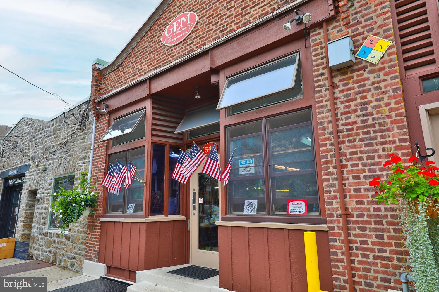 Rare Commercial Opportunity in busy Mount Airy business hub. Two adjoining buildings (Tax IDs 882920545 and 882920550) functioning as one. Zoned Mixed Use CMX-2. Approximately 3,800.00 Sq Ft. with the street addresses, 546-548 Carpenter Lane. Side by side buildings connected with multiple walkthroughs including in the basement. There is one full bath and three half baths, with three stairways to the basement. The ceilings are 11 feet in both buildings with industrial fans located on the roofs. Both buildings are deeded separately and both have large open floor plan areas. A new torch down bitumen roof was installed recently. There are two sidewalk steel cellar doors, one for each building. 45 Feet across the front of the buildings is zoned Loading Zone Only Mon to Sat 8am to 4:30pm. At this time this accommodates the owner's car and the delivery van for the business. Phase I Environmental Site Assessment was performed in 2013. Please see detailed attached documents for more information on possible uses. Just across the street from the popular and historic Mount Airy Weavers Way Cooperative Grocery and many other businesses.
Please call Martha Hill for showing appointments.