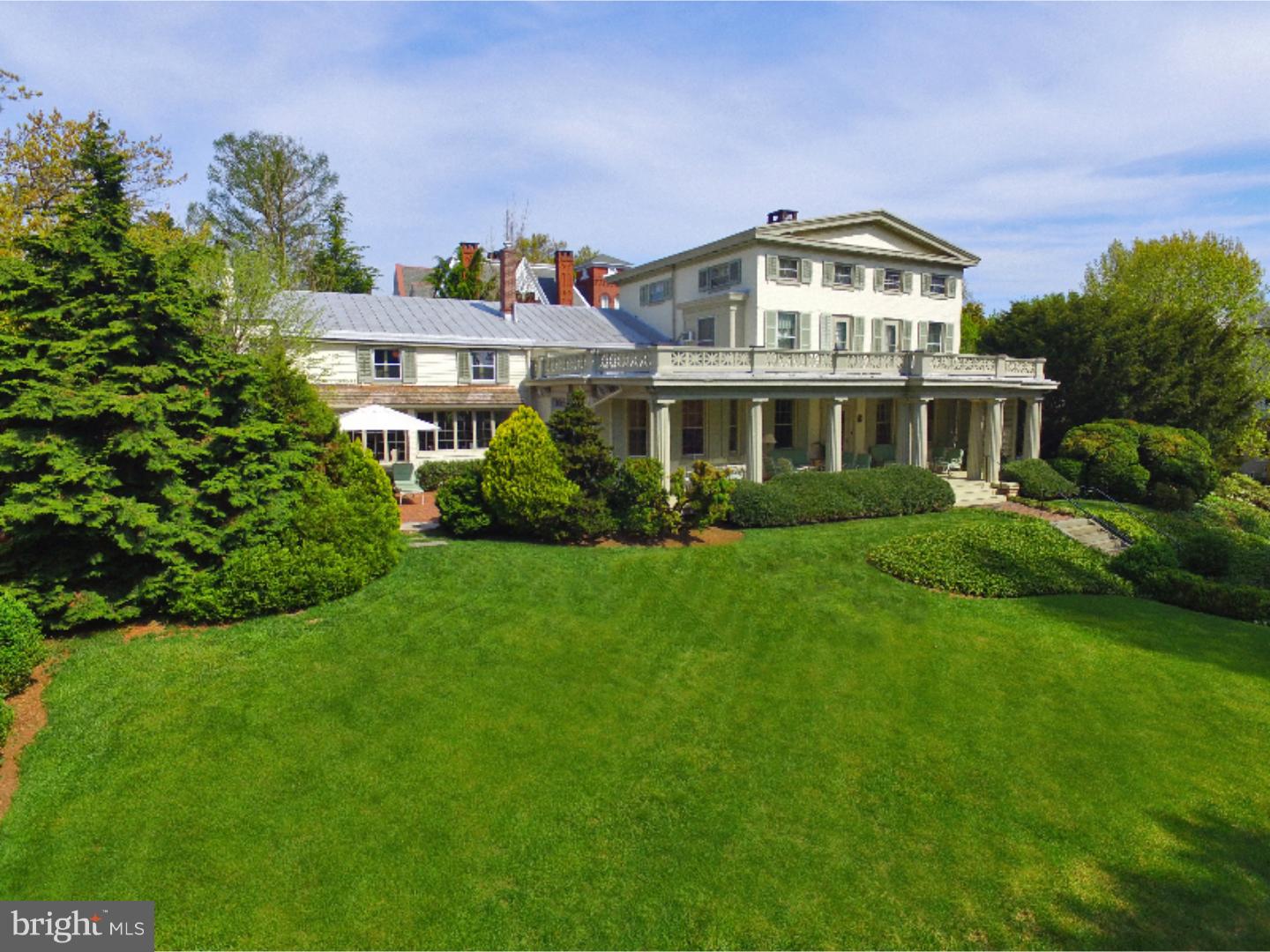 The original house of Philip Sharples with bricks for construction supplied by the Sharples brick yards in West Chester. Of the six owners prior to the current owner, movie star Claude Rains, the original invisible man, purchased it in 1958. Exceptional architectural appointments with Greek revival details. Situated on a large corner location of South Church Street and Dean Street, is walking distance to all the downtown borough amenities. Two car attached garage, over a half acre of lush grounds with exceptional plantings and landscaping, outdoor brick patio area, two covered porches, second floor roof deck makes this home perfect for entertaining. The inside and the outside of this home offers many of its original architectural detail. Extensive original wood flooring throughout, formal living room with wood burning fireplace, parlor room/family room with gas fireplace, oversized formal dining room with built-in cupboards, access to rear brick patio area, butler's pantry, large and spacious kitchen featuring built-in subzero refrigerator, antique tile backsplash, commercial grade stainless steel natural gas stove with Viking exhaust, breakfast area, open to family room with fireplace. First floor garden room area with access from attached two car garage, first floor patio. Second floor offers four bedrooms, three full baths, two of the three guest bedrooms offer access to the roof deck. Third floor offers two additional bedrooms, one with large sitting room, additional hall baths. Full dry and cement floor basement. First floor central air conditioning, new high efficiency natural gas steam furnace. Home features a total of 6 bedrooms, 5.5 baths.