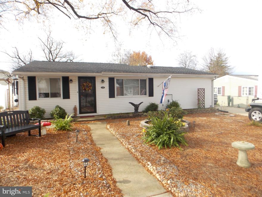 A mechanic's dream home. This lovely 3br 1.5 bath home has so much to offer. Enjoy the wonderful stone landscaped yard which has a area for grilling  and relaxing. Home has camper plug and generator plug for power outages and such.  New carpet and wonderful hardwood floors. Two car garage with car lift that does come with the home.  Spacious eat-in  kitchen with separate dinning room.  Stereo System for entertainment   and surround sound that is already installed for you. Forced air heat along with central air.  All other equipment in garage does not come with the home but seller says they are taking offers on them.