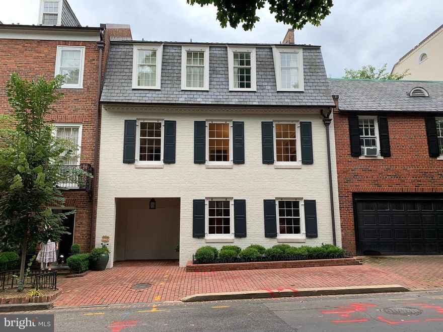 Beautiful interior row house designed by renowned DC architect Walter G. Peter Jr. Nearly 5,000sq/ft of elegant and light-filled living space. Complete with private brick Patio and Garden with boxwoods. 2-Car Garage Parking and Elevator.