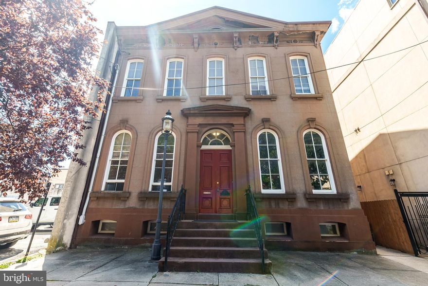 MOTIVATED SELLER! 318-20 Bainbridge St. - Double Wide Nestled in the heart of Queen Village, within the esteemed Meredith School catchment, lies a truly unique and rarely offered brownstone building, spanning an impressive 40x110 feet. This architectural gem, dating back to circa 1840, is a testament to timeless elegance and charm. With the space for expansion/construction, the property boasts an enormous, country-like landscaped garden (40x55/2100 sq ft) WOW! Unheard of in the city! This magnificent building houses three fabulous apartments, each offering a distinct living experience with modern comforts and historical charm. Unit A: The Penthouse unit, sized at 1,700 square feet, features three bedrooms and two bathrooms. It is a spacious retreat boasting expansive living spaces, perfect for those who enjoy luxury and comfort. With its high ceilings and floor-to-ceiling windows, natural light floods the rooms, highlighting the beautifully refinished original hardwood floors. Unit B: offers a stylish bilevel layout that maximizes space and functionality, with a size of 1,000 square feet, two bedrooms, and two bathrooms. This unit is ideal for those seeking a cozy yet sophisticated environment, complete with charming architectural details and modern amenities. Unit C: combines elegance and convenience in its expansive bi-level design, offering 1,500 square feet with two bedrooms and two bathrooms. Perfect for entertaining or relaxing, this unit features sizable bedrooms, a cook’s kitchen, and a spa-like bath that offers a luxurious retreat. Each unit within this brownstone has a spectacular view of Bainbridge Green Park and the enormous rear garden in addition to being a showcase of gorgeous details and thoughtful design. Original hardwood floors are expertly refinished to preserve historical integrity, and high ceilings enhance the sense of space and grandeur. Floor-to-ceiling windows allow for an abundance of natural light. Gorgeous cooks kitchens and spa baths are designed for modern living and comfort. Detailed woodwork and fireplaces add warmth and character, while exposed brick and private balconies offer a unique blend of urban and rustic charm. This extraordinary building offers incredible amounts of space and numerous possibilities. Keep it as a triplex for rental income, convert it to condos for investment opportunities, transform it into a single-family mansion, live in one unit and rent the others for additional income, or convert back to a commercial office space very easily. With its exceptional location and unmatched character, this brownstone is a rare gem in Queen Village. Whether as an investment or a personal residence, it promises a lifestyle of elegance and convenience. Don’t miss the chance to own a piece of history in one of the city's most sought-after neighborhoods.