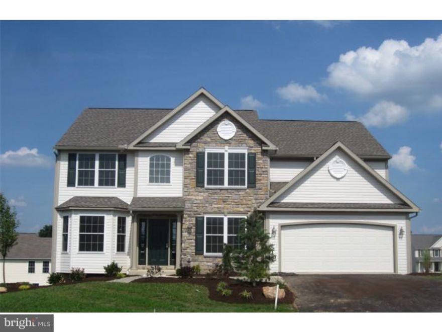 The England II Model w-WALK-OUT BSMNT. Price listed is after the Builder Credit has been deducted. Extensive list of standard features including finished garage, full deck, elegant front door & sidelites, partially drywalled basement ready for finish. High Eff Gas Heat/Central Air. Convenient 2nd fl laundry. 1st fl library/office. 1st fl ceilings 8'6". Kitchen w-custom, hand-crafted Olde Mill cabinetry with large pantry plus island. 2 Story Fam Rm w-gas FP. MBR w-vaulted ceiling & fan. Warm hardwood flooring in DR. Extensive Tile flooring: Foyer, Kitchen, Laundry and all Bathrooms. Gorgeous Master Bath w- walk-in,tiled shower. Walk just across the way to the largest & newest community park situated along one of the most beautiful stretches of the Schuylkill River with playgrounds, pavilions & sports fields. Just off Rte 61, nearby to Rts 222 & 422