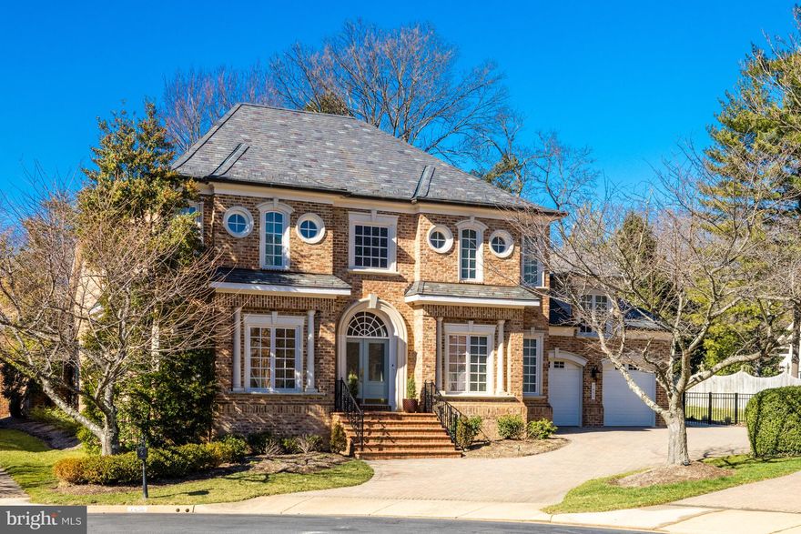 Welcome to 7450 Old Maple Square, a stunning residence nestled in the back of a gated community of just thirty-two homes. This stunning home boasts 7,000 sq ft of totally renovated living area tailored for today's lifestyle. This exquisite property offers unparalleled luxury and comfort, providing a sanctuary for those seeking refined living in a prime location. As you approach the property's graceful exterior, you'll be captivated by its elegant appearance, featuring classic architectural details and manicured landscaping. Step inside to discover a completely and thoughtfully renovated interior, boasting sophisticated design elements with every detail meticulously curated using premium finishes. The two-story open foyer provides a dramatic entrance into the residence, with circular stairs to the side and flows into the main living areas with 12 ft ceilings. The foyer is flanked by a front library with a wall of built-ins and French doors for privacy, and a light-filled front office. The spacious main level is ideal for both relaxing and entertaining, with a seamless flow between the interior living spaces and the outside brick patio with a grill and fountain. The gourmet kitchen is a chef's delight, equipped with top-of-the-line appliances, custom cabinetry, and a large eat-up center island, perfect for culinary creations and informal entertaining. Adjacent is the formal dining area, perfect for hosting memorable gatherings with friends and family. Retreat to the luxurious owner's suite with a sitting room with French doors to the patio. It is complete with a spa-like ensuite bath and custom-designed closet space, a coffee bar, and a gas fireplace, providing a serene oasis to unwind after a long day. The main level is completed with a mudroom/laundry room that has built-ins, a coat closet, a sink, a utility closet, and a two-car garage. The upper level offers guests and family members comfort and privacy with three spacious bedrooms, including an ensuite. The lower level was finished for today's modern lifestyle with a huge recreation room set up for a media area and billiards and darts area, and a complete bar including two side-by-side built-in wine coolers. The lower level includes a spacious exercise room with an adjoining bath and a large bedroom with a sitting area and private bath. Located in the heart of McLean, this home offers convenient access to a wealth of amenities, including upscale shopping, fine dining, and premier schools. Just minutes to the Silver Line Metro, Tysons and McLean, and 495, I-66, and the Dulles Toll Road for commuting to Washington D.C., Maryland, and the Dulles Tech Corridor. Experience the epitome of luxury living in this gem of a house. An extensive list of upgrades and improvements can be accessed in the Document Section.