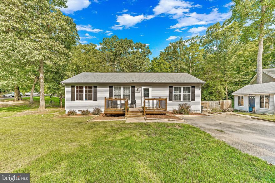 Open Floorplan! 1144 Sqft 3 Bedroom 2 Bathroom Rambler on a Nice Corner Lot! Walking up you will notice the oversized front stoop area and the flat front/side yards. Entering the front door you are greeted by an open kitchen/family room area that is the heart of this home. The kitchen has a large island, painted cabinets, marble tiled countertops, stainless appliances, and updated flooring. To the right of the family room you will find the large primary bedroom that has a large closet, dual vanity, and separate shower/water closet. To the left of the family room you will find the second and third bedrooms as well as a full bathroom to serve them. The 3rd bedroom is multifunctional with a double glass door that opens to the family room. This allows you to use the space as a bedroom, office, guest area, or expanded family room. This unique floor plan creates a large primary suite than what you would find in similar homes of this size as well. Outside the corner lot allows for a large flat side yard, an nicely sized driveway, multitiered deck, and a storage shed that could be refinished or replaced by the new owner. The community amenities include multiple private beaches and lakes along the Chesapeake Bay, basket ball courts, ball fields, community gardens, a private airport, and a large playground. This home at this price point is sure not to last!