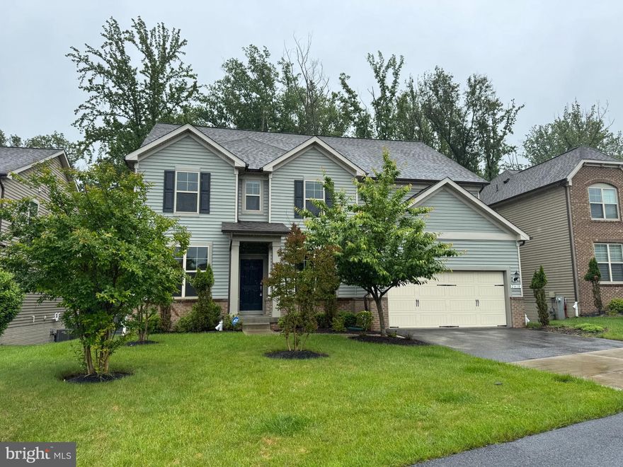 Welcome to this beautiful home in the vibrant community of Estates at Patapsco Park. This former builder’s model features a thoughtfully designed floorplan with abundant natural light throughout.

Highlights include a gourmet kitchen with granite countertops, hardwood flooring on the main level, a first-floor bedroom and full bath, a gas fireplace with built-in bookshelves, a planning center, a two-story gathering room extension, sunroom, loft, and a fully finished lower level. Also, home features LeafFilter system to minimize debris buildup in gutters.

The home is currently vacant; some images reflect rooms when previously staged. The property backs to trees, offering added privacy and scenic views.

Enjoy outdoor living with two spacious decks—one off the living room and another off the main-level bedroom—perfect for relaxing or entertaining.

Conveniently located near schools and just a short drive to historic Ellicott City, this home offers both comfort and accessibility.

Don’t miss the opportunity to make this exceptional home yours.