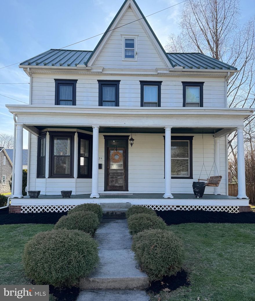 This charming Colonial-Victorian home, nestled in the heart of Lower Allen Township, offers a perfect blend of classic elegance and modern comfort. With 2,418 sq. ft. of thoughtfully designed living space, this residence features four spacious bedrooms and two and a half bathrooms, ensuring ample room for relaxation and entertaining. Step up to the inviting front porch and inside to discover a warm and inviting interior, highlighted by beautiful wood floors and an abundance of natural light. The open floor plan includes a FABULOUS kitchen with a HUGE island!! The kitchen is the heart of the home, and this main floor is perfect for entertaining and family-living! The large dining area and family room will charm you with their new windows, farmhouse feel and attention commanding fireplace!  The washer and dryer are conveniently located in the first-floor half bath. Upstairs, the primary suite boasts a luxurious bath and a generous walk-in closet, providing a private retreat.  Two additional bedrooms and a second full bath complete the second floor. The third floor is yours to design...the finished space could be a fourth bedroom, home office or man-cave! Outside there's an abundance of space including a huge deck (that will be power-washed and freshly stained before settlement!), a gas line that's been conveniently run to the deck to make grilling a breeze, and a fenced-in yard making your new home the perfect spot for outdoor gatherings and playtime. The garage/barn offers additional space for your car or hobbies and tools.  Located in a serene suburban setting, this home combines the charm of a historic build with modern amenities, making it an ideal sanctuary for those seeking comfort and convenience. Experience the warmth and character of this delightful property—your new home awaits!