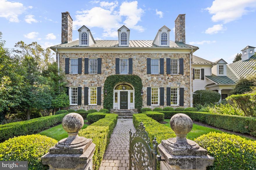 Open House Cancelled. Seller received compelling offer. 

Privately appointed on nearly 2 acres in the coveted McLean community, 8408 Parham Court presents an elegantly crafted 1997 Colonial encompassed by pristinely manicured gardens, mature trees and sprawling lawns. Inside the home’s stately fieldstone façade, soaring ceilings, magnificent millwork and exquisite design details are on display throughout the 10,150 square foot home’s 3 levels. 
<br>
<br>
Formal Living and Dining Rooms flanking the entry foyer and more informal Family Room, Solarium and Library appointed towards the rear of the residence. Adorned with numerous fireplaces, whether you’re hosting large-scale gatherings or enjoying the simplicities of day-to-day living, any guest is sure to feel at home. The heart of this enchanting residence resides in the noteworthy Gourmet Kitchen. Complete with high-end stainless-steel appliances, abundant counterspace, 3 wine refrigerators, a 6-burner gas range, two dishwashers, an adjacent Breakfast Room and a Butler’s Pantry encompass this Chef’s Kitchen. Covered porches and sprawling patios line the rear of the residence to offer the perfect place for alfresco dining overlooking the lush lawns and gorgeous gardens. A Laundry Room, complete with a Pet Shower, and a Mudroom are located on the Main Level and provide interior access to the oversized 3-Car Attached Garage. 
<br>
<br>
The Upper Level showcases the principal guest rooms to include an expansive Owner’s oasis. Boasting Cathedral Ceilings and a private Balcony overlooking the property’s breathtaking grounds. The Primary Suite features two gas fireplaces, a private Sitting Room, Wet Bar, and Dressing Area complete with two large and outfitted Walk-In Closets. The Primary Bathroom opens to reveal a luxurious soaking tub, stall shower, two vanities and two water closets. A large Upper-Level Family Room, 3 additional ensuite Bedrooms and extra storage closets complete the level’s offerings.
<br>
<br>
The fully finished, walkout Lower-Level debuts a sprawling In-Law Suite sure to delight any long-term guest. Featuring a private separate entrance, the Suite boasts a fully outfitted Kitchen with Butler’s Pantry, a Dining Room, Living Room, an ensuite Bedroom with multiple walk-in closets, a Laundry Room and a private Patio. The Lower Level is also equipped with a Home Theatre, Gym, Office Space with a Full Bathroom, and numerous Storage Rooms. 
<br>
<br>
Debuting a seamless synthesis of ageless design, luxurious comfort, and modern functionality, this 5 Bedroom, 7 Full Bathroom, 2 Half Bathroom abode exudes sophistication and serenity at every turn.