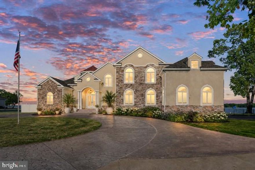 Welcome to an extraordinary private waterfront estate perfectly situated on a premier point along the Potomac River! This property has over 3 acres and 900+ ft of shoreline with some of the most breathtaking sunrise views you’ll ever see over the water.

From the moment you pull in, this home makes a statement with the grand architecture, expanded stamped concrete circular driveway, and beautifully landscaped grounds that perfectly fit the waterfront setting. Custom built with a luxury coastal vibe that feels both elegant and relaxed at the same time.

The back of the home is truly where this property turns into a private waterfront retreat! Multiple outdoor living spaces including patios, balconies, and lounge areas all designed to capture the wide open river views. An added bonus to this incredible waterfront property is the oversized garage designed with functionality in mind for boating and recreational enthusiasts. Featuring an extra-tall approximately 16-foot garage door, the space easily accommodates large boats, RVs, and other oversized vehicles. The sellers have comfortably stored a 35-foot boat inside, and the property also includes an impressive 20,000-pound boat lift—perfect for effortless access to the water and enjoying the ultimate waterfront lifestyle. Whether it’s peaceful mornings watching the sunrise or entertaining friends by the water… every inch of this property was made to enjoy the lifestyle.

Walk right down to your own private sandy beach and sandbar 🏖️ — an incredibly rare feature that makes this property feel like your own private resort. Concrete steps lead directly to the shoreline while updated riprap, jetties, and shoreline improvements provide long term peace of mind.

One of the best parts about this location is the pier sits on the protected creek side, helping keep your boats and jet skis sheltered during storms and rough weather! The private pier features Trex decking, electric, water, covered boat lift, and jet ski lift… river life made easy.

Inside you’ll immediately notice the craftsmanship and attention to detail throughout. Gorgeous custom tile work in every bathroom and even the outdoor shower gives the home a high-end designer feel throughout. The construction itself is impressive too with all concrete foundation + flooring systems and structural steel beams in the basement offering exceptional strength and durability rarely found in waterfront homes.

Additional features include an elevator, fireplaces in both the family room and primary suite, plus a private second floor bar and balcony overlooking the river… and honestly the sunrise views from up there are unreal ☀️

Major updates have already been completed ✔️ including a new roof, updated HVAC systems, upgraded fixtures, gourmet appliances and full indoor/outdoor security system with cloud + DVR recording plus your sprinkler system to keep your lawn beautiful on hot summer days!

And the setting would be absolutely perfect for an infinity pool overlooking the river someday! The possibilities are endless! This would make a perfect wedding venue or even a luxury air bnb if it's not your primary home!

With unmatched water frontage, privacy, protected docking, your own private beach/sandbar, custom outdoor shower, elevator,  and incredible construction quality… this isn’t just a home, it’s a true Potomac River retreat.

Contact me to schedule a  private showing and come experience it in person!