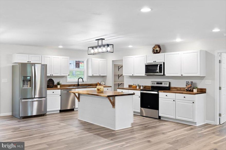 PREFERRED LENDER WILL PAY 1% OF LOAN AMOUNT FOR BUYERS CLOSING COSTS - Welcome to this newly constructed home, featuring a delightful covered front porch that warmly invites you inside. The open floor plan showcases a well-designed split-bedroom arrangement, ensuring both privacy and comfort. The kitchen is equipped with beautiful butcher block countertops, stainless steel appliances, and a practical pantry that also serves as a laundry room. Step out onto the expansive deck, perfect for entertaining guests. Additionally, a one-year builder's warranty is included for your peace of mind. Situated near Bryce Resort, you'll enjoy convenient access to a wide array of amenities, such as skiing, tubing, golfing, fishing, and picturesque lakeside walks. Visit their website to explore everything Bryce has to offer!