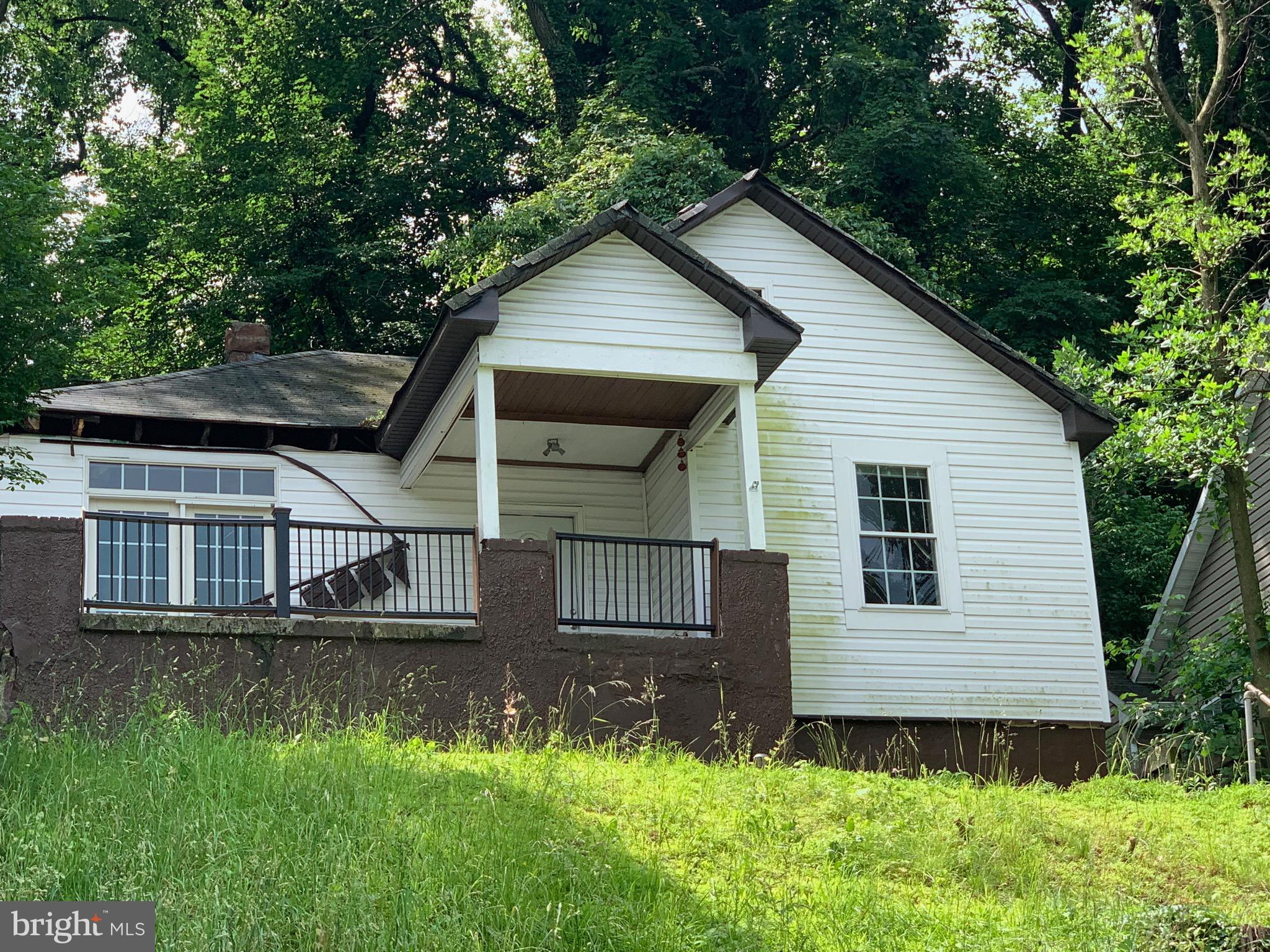Fire Sale. Out-of-State Investor Bought at Auction and Now Pulling Money for New Project. Instant Equity. Immediate Neighbor just sold for 163K & many area homes selling over 200K. Some renovation needed but you'll be amazed at the condition. Plus, you'll love this cute home set back from the road and up on a hill with a view over the Gwynns Falls River & a stones throw from the Gwynn Oak Park's Walking, Hiking and Bike Paths. Enjoy the spacious layout, hardwood floors, HVAC system, updates to kitchen & bath and the opportunity to renovate to make it your own. Perfect for FHA 203K Buyer or Investors. Don't miss out!